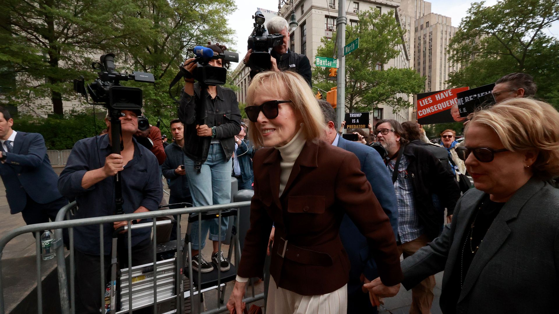 E. Jean Carroll and her legal team arriving at a New York court in May 2023.