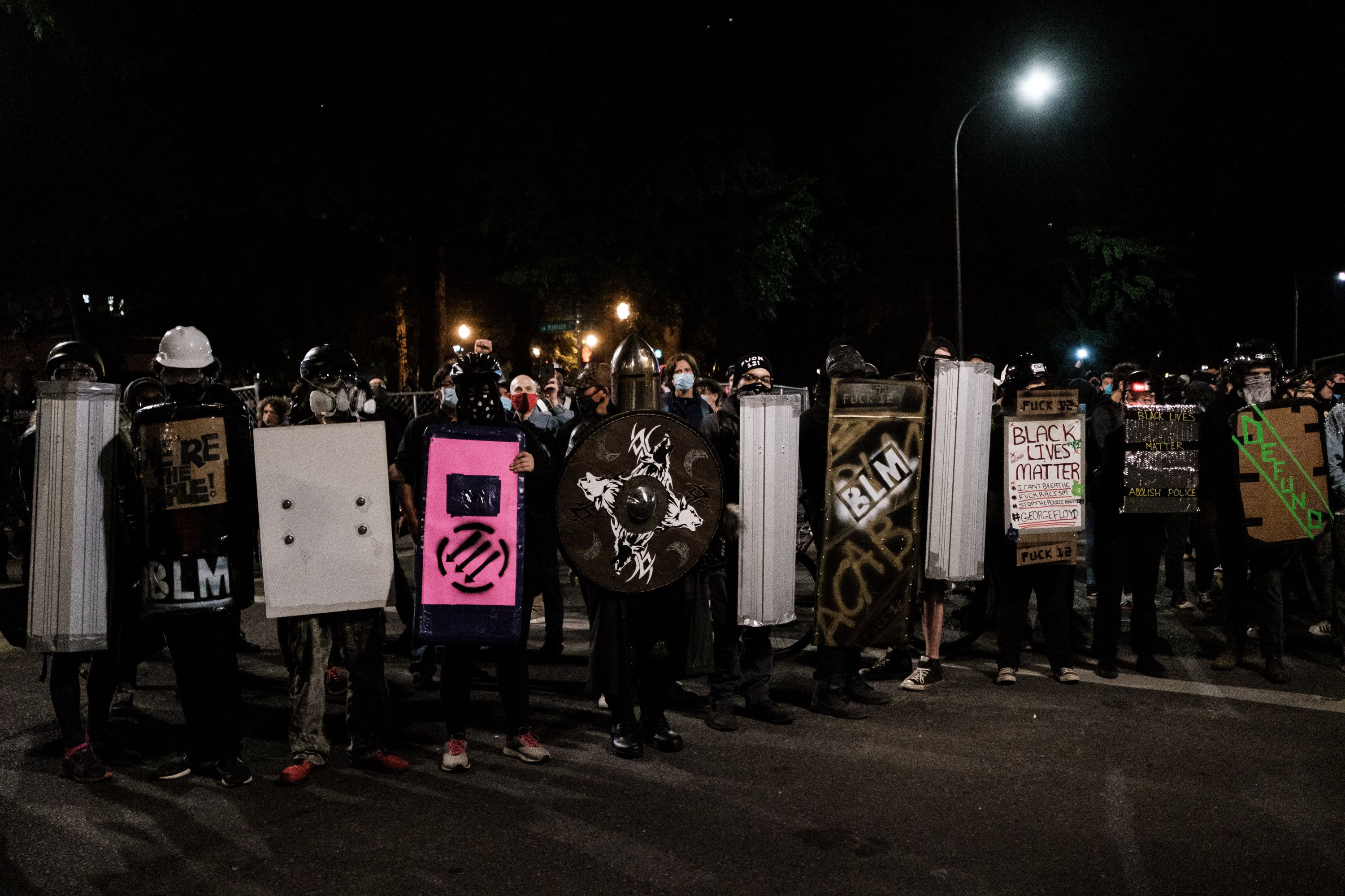 Protestors prepare for conflict with the federal law enforcers. Photo: Mason Trinca/Getty Images