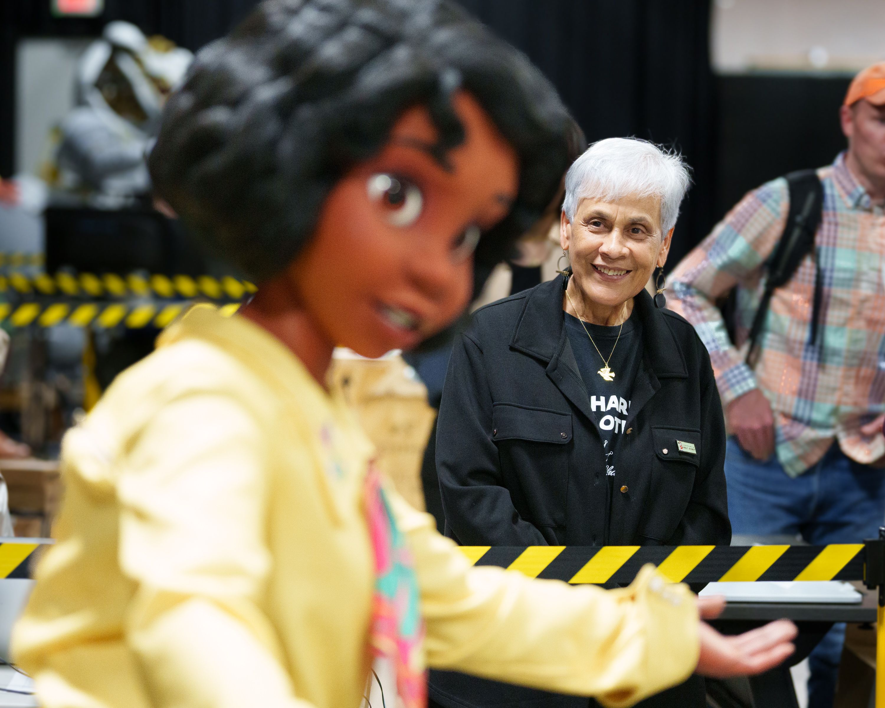 Stella Chase Reese looks at the Princess Tiana animatronic that was inspired by her mom, Leah Chase.