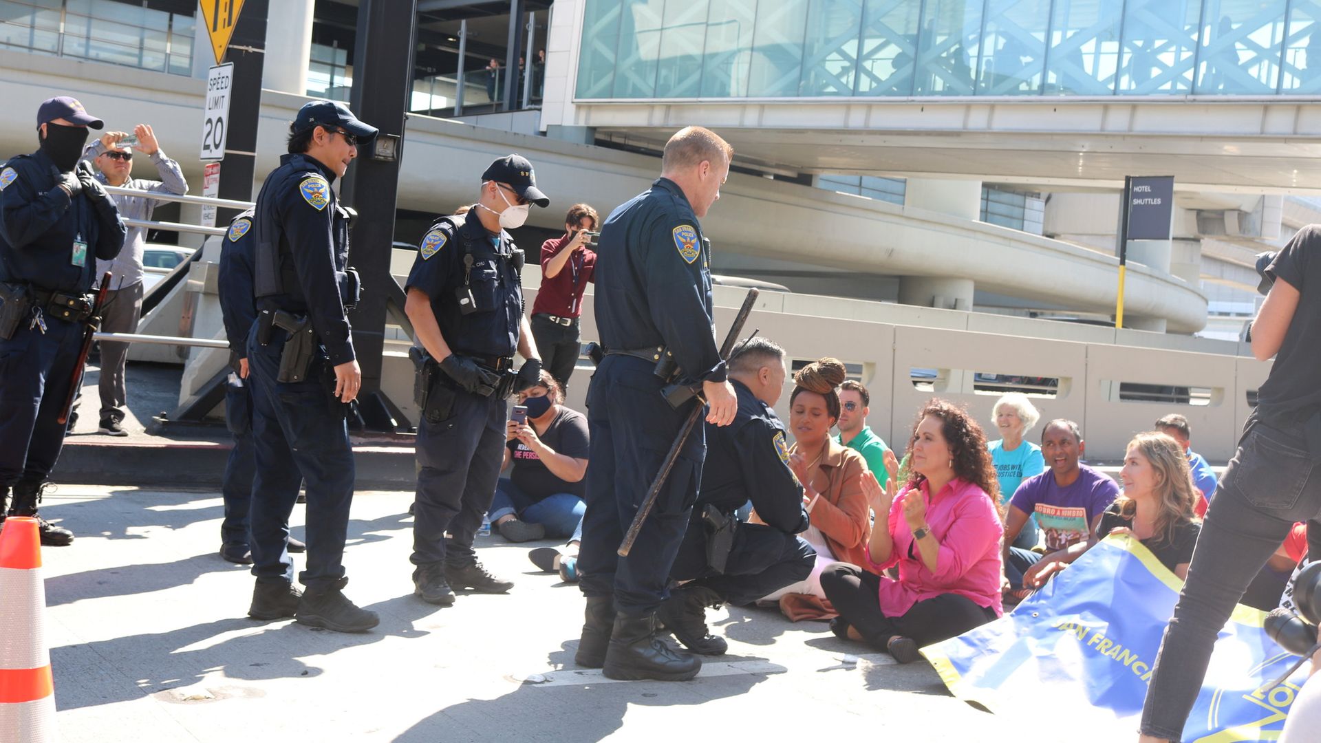 Police talk with protestors at SFO 