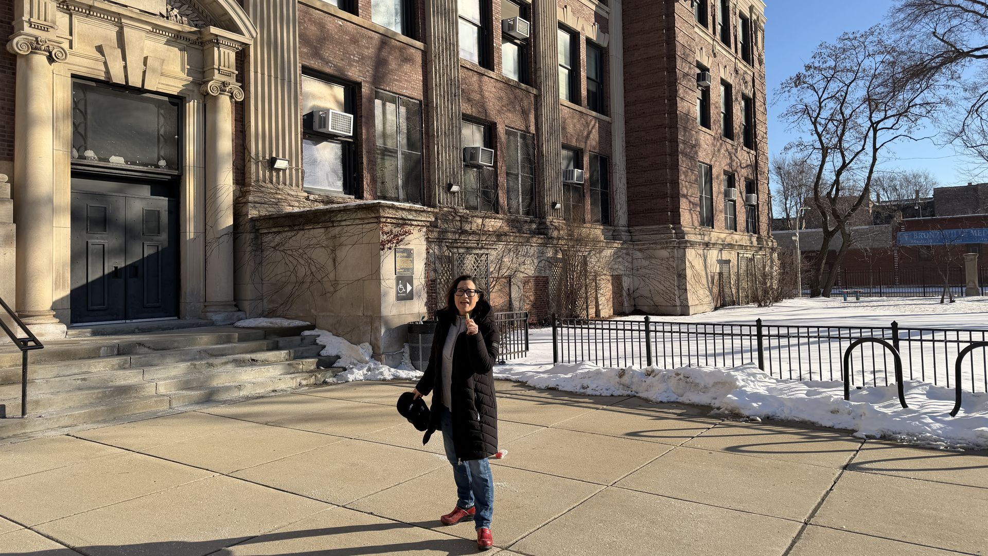 woman in front of an old building 