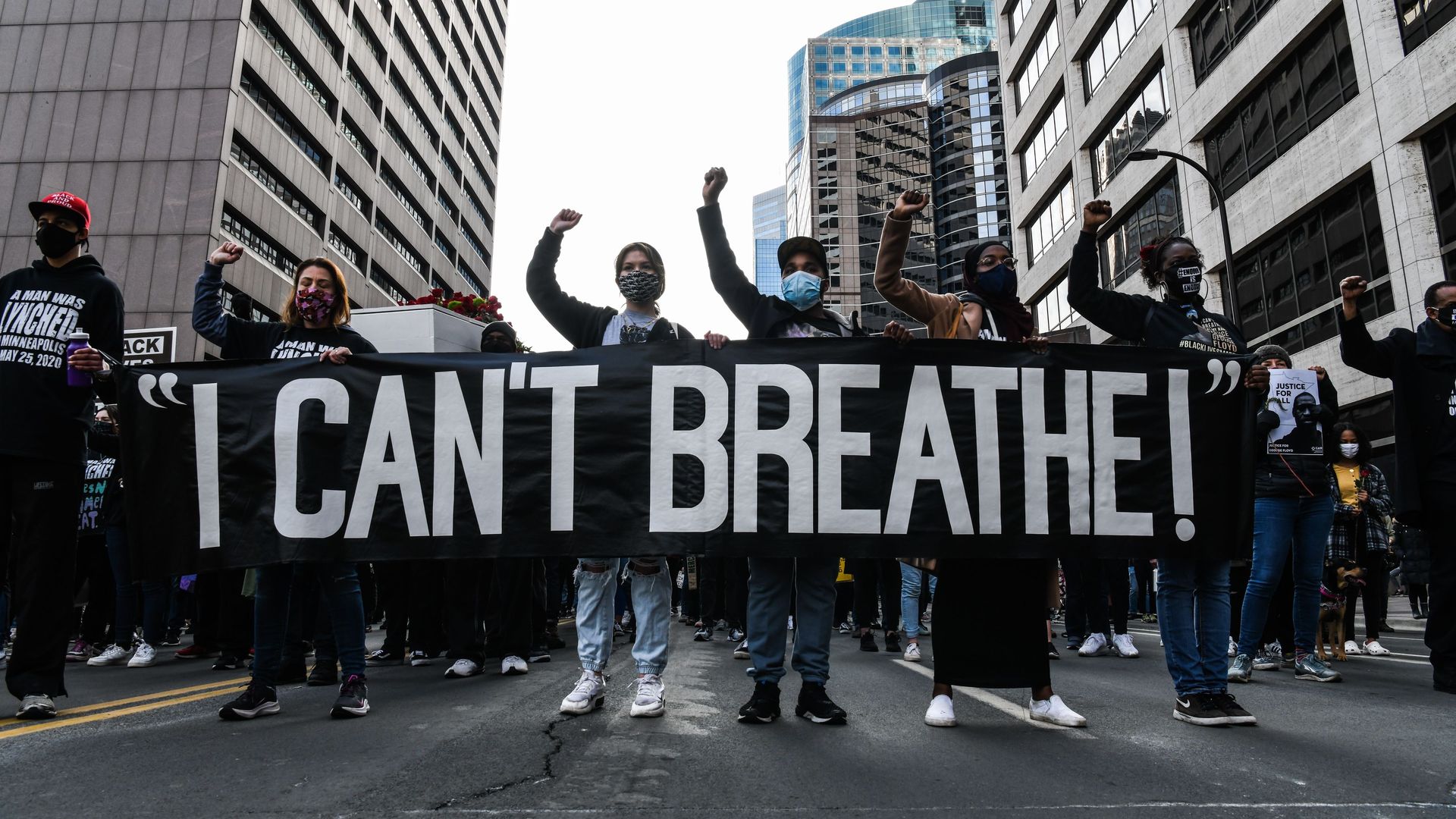 Demonstrators hold a banner during the I Cant Breathe - Silent March for Justice in front of the Hennepin County Government Center on March 7.