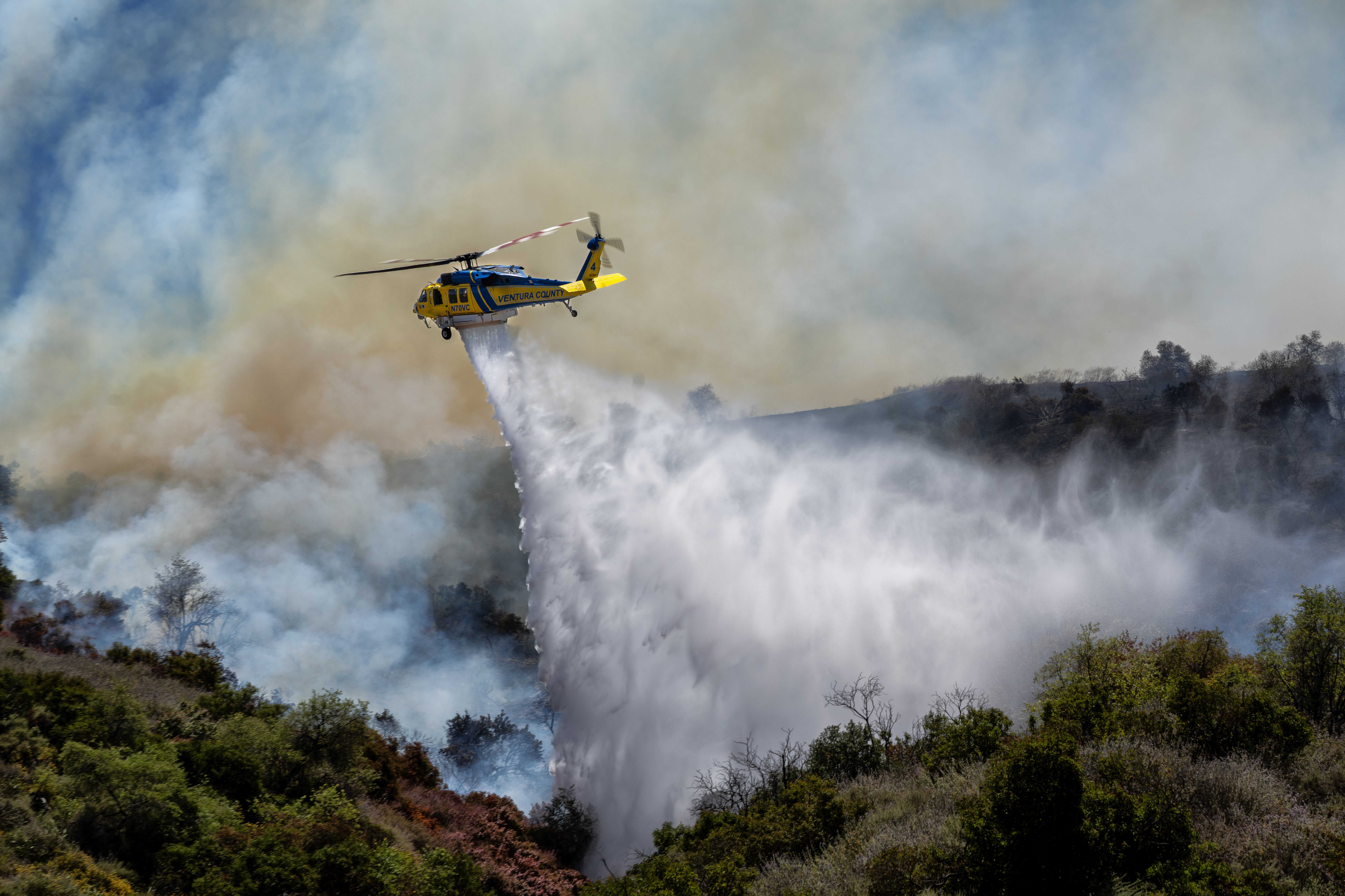A helicopter battles a wildfire in Simi Valley, California, in May. Photo: Hans Gutknecht/MediaNews Group/The Los Angeles Daily News via Getty Images