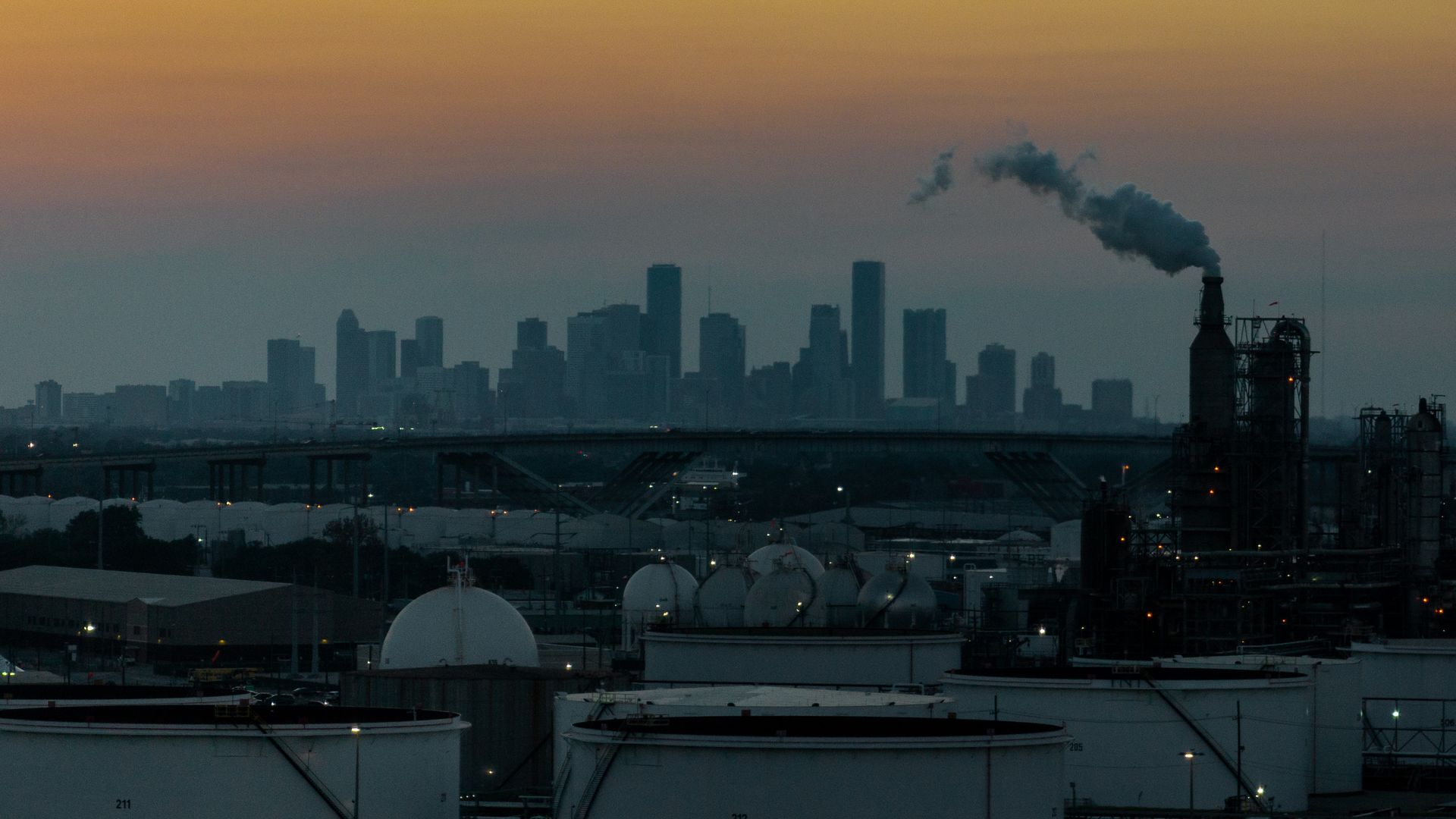 Sun setting over a skyline in the distance