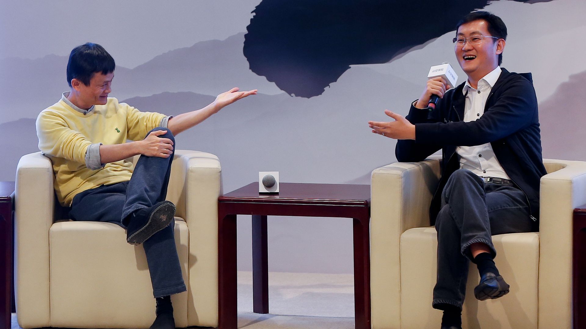 Jack Ma and Pony Ma speaking at a conference