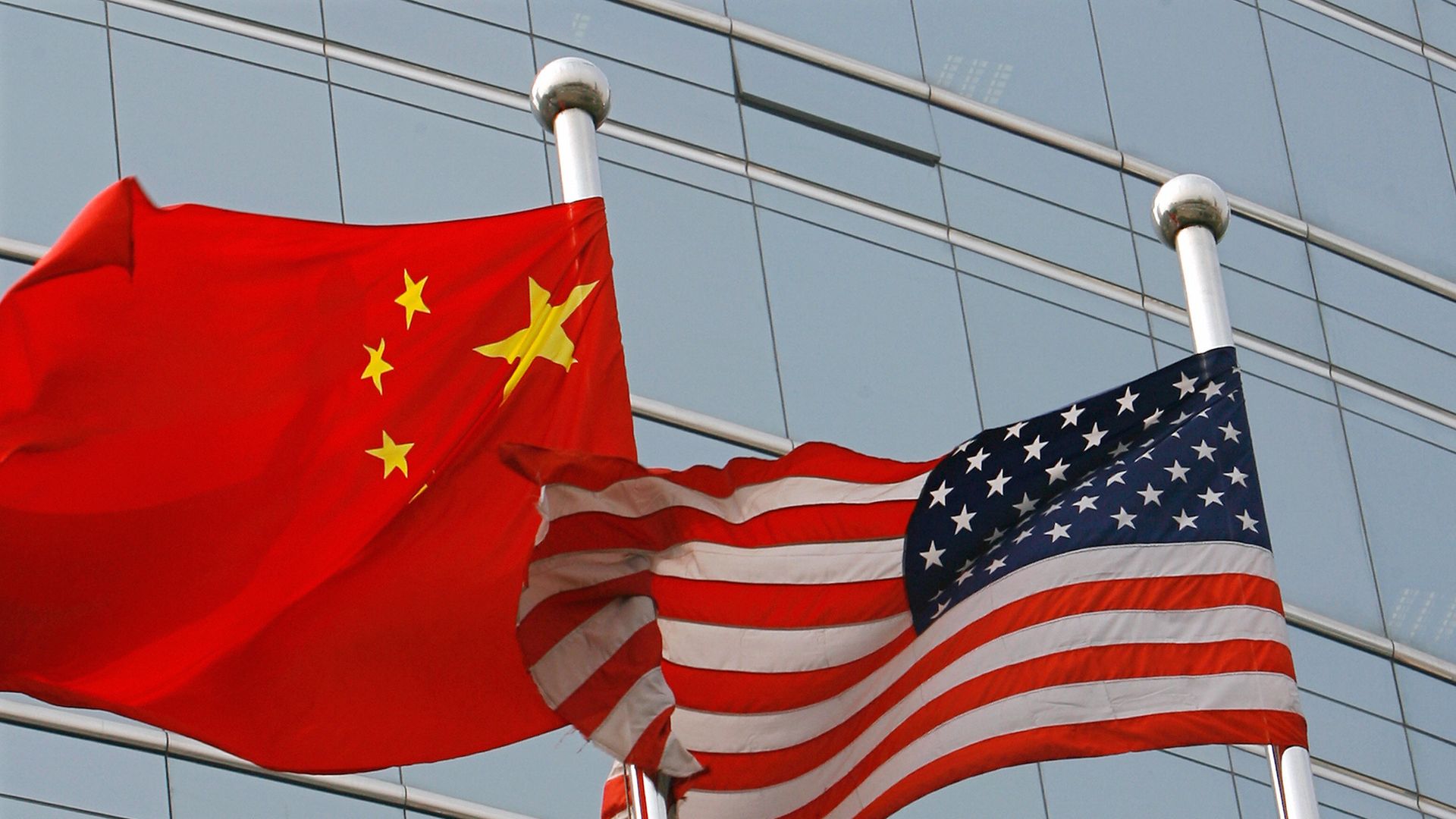U.S. and Chinese flags fly side by side