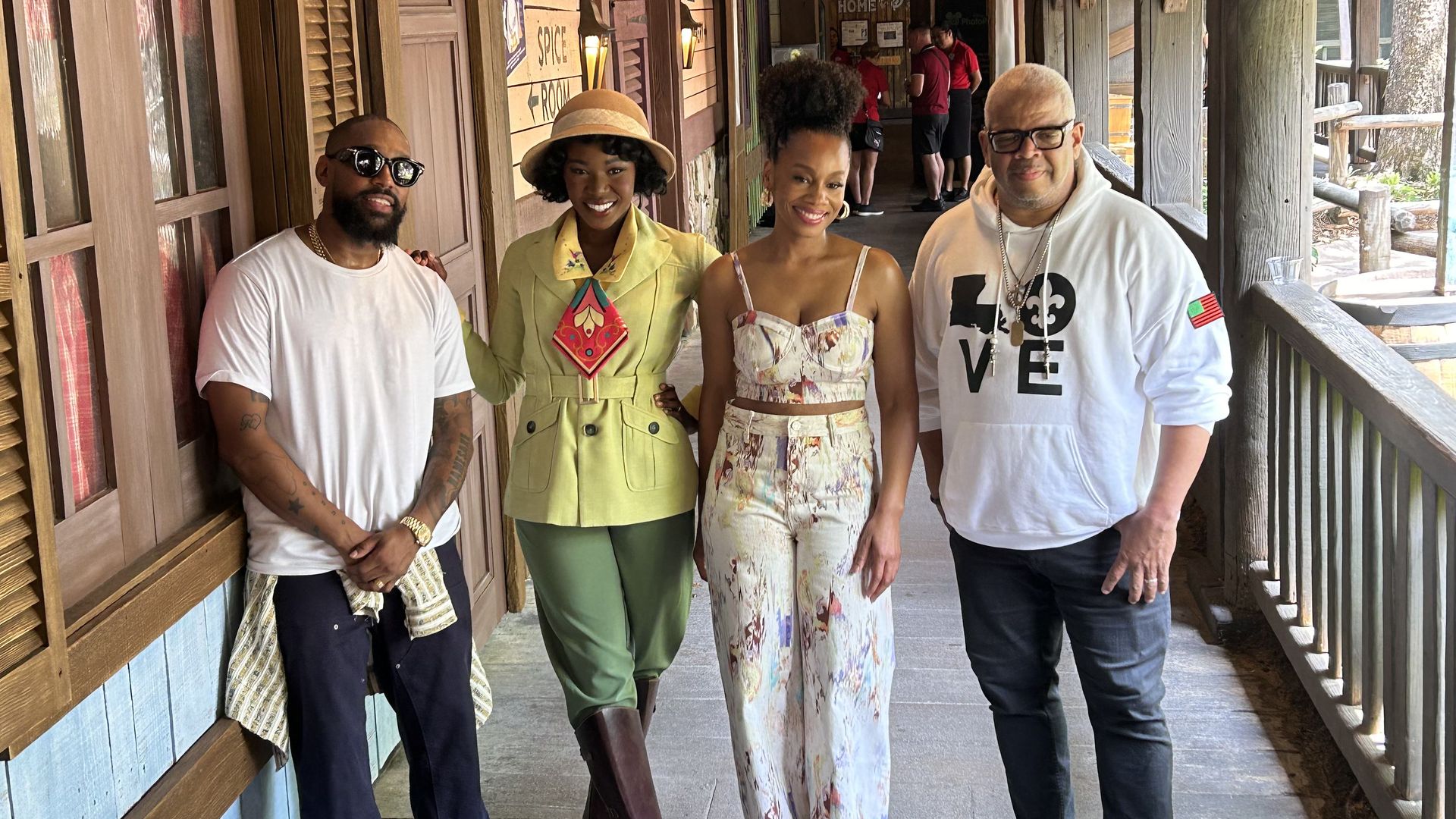 A character in costume as Tiana poses with Anika Noni Rose, the actress who voiced the character.