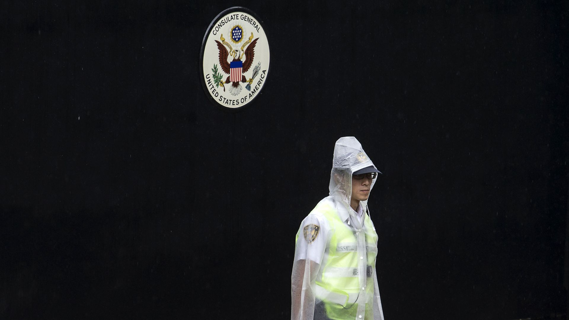 A police officer at the entry of a U.S. consulate in China.