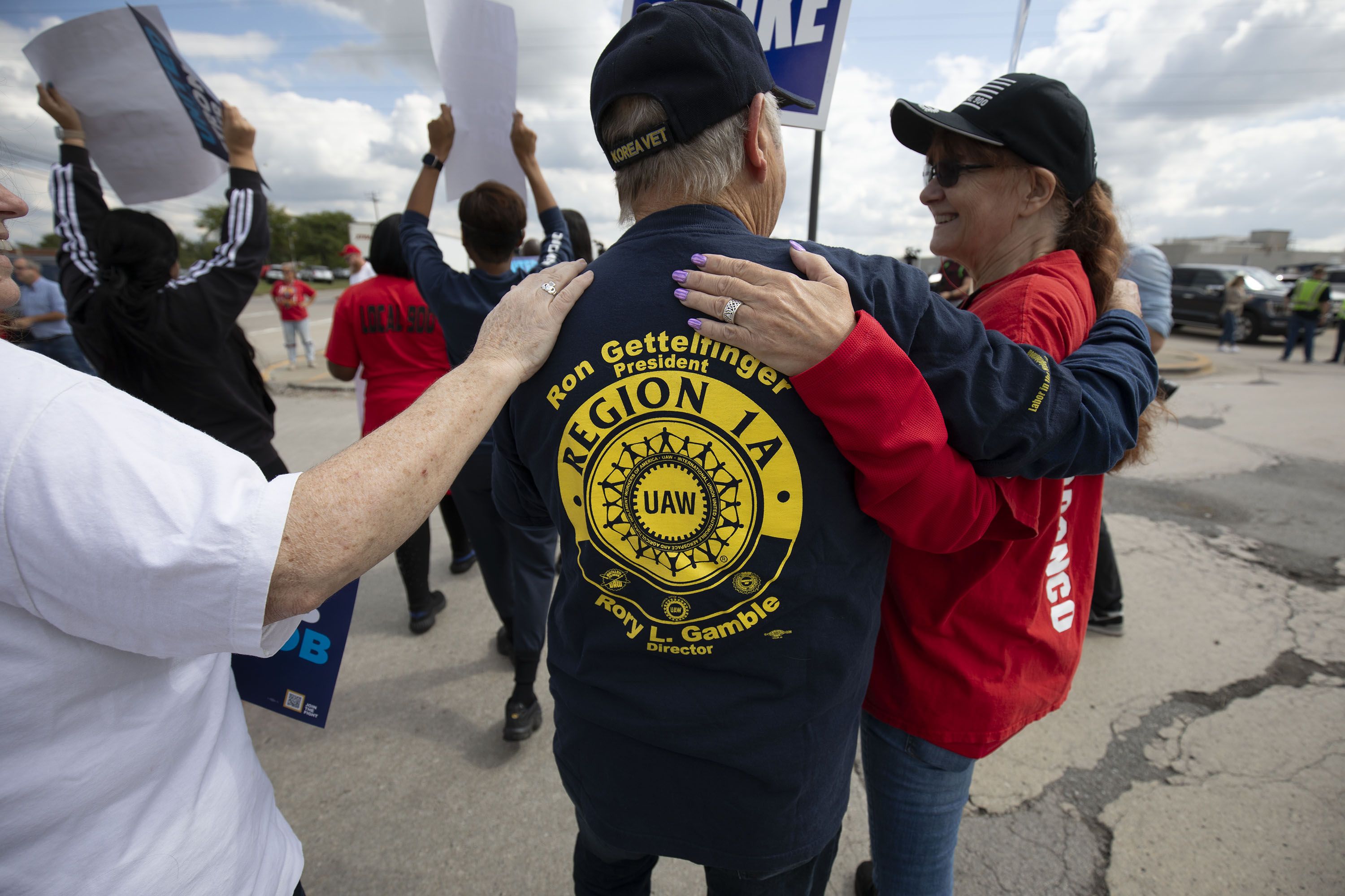 UAW members embracing outside a Ford assembly plant in Wayne, Michigan, on Sept. 15.