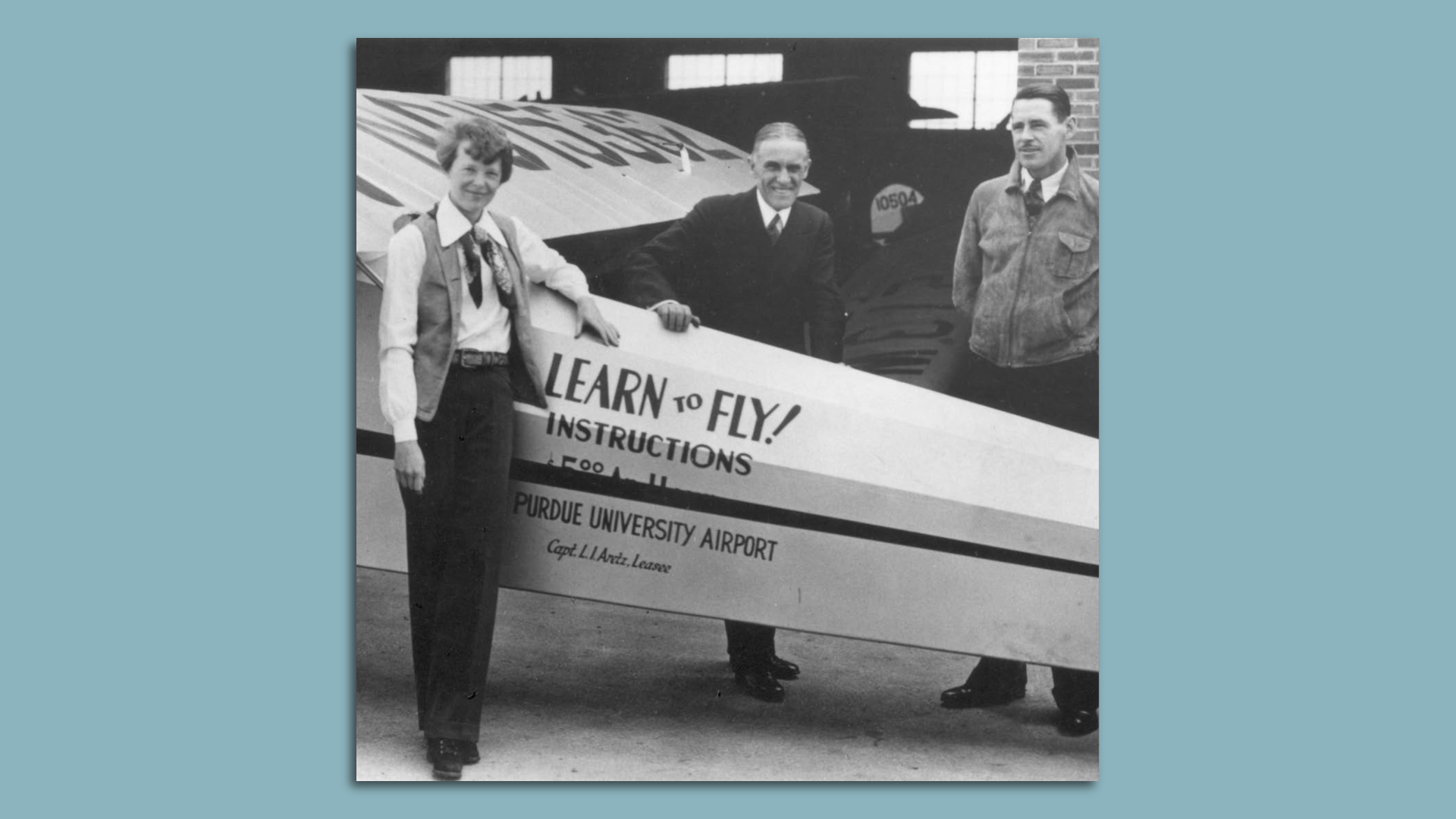 A picture of Amelia Earhart next to a plane and two men on a blue background