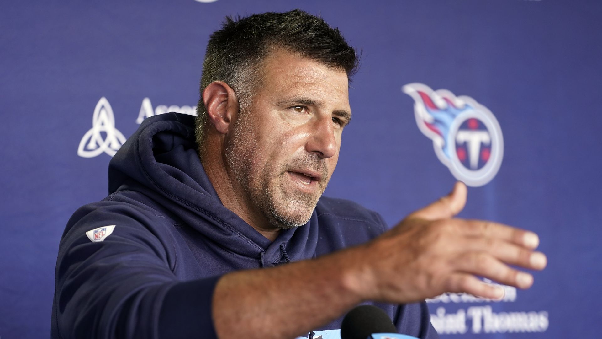 Mike Vrabel at a podium.