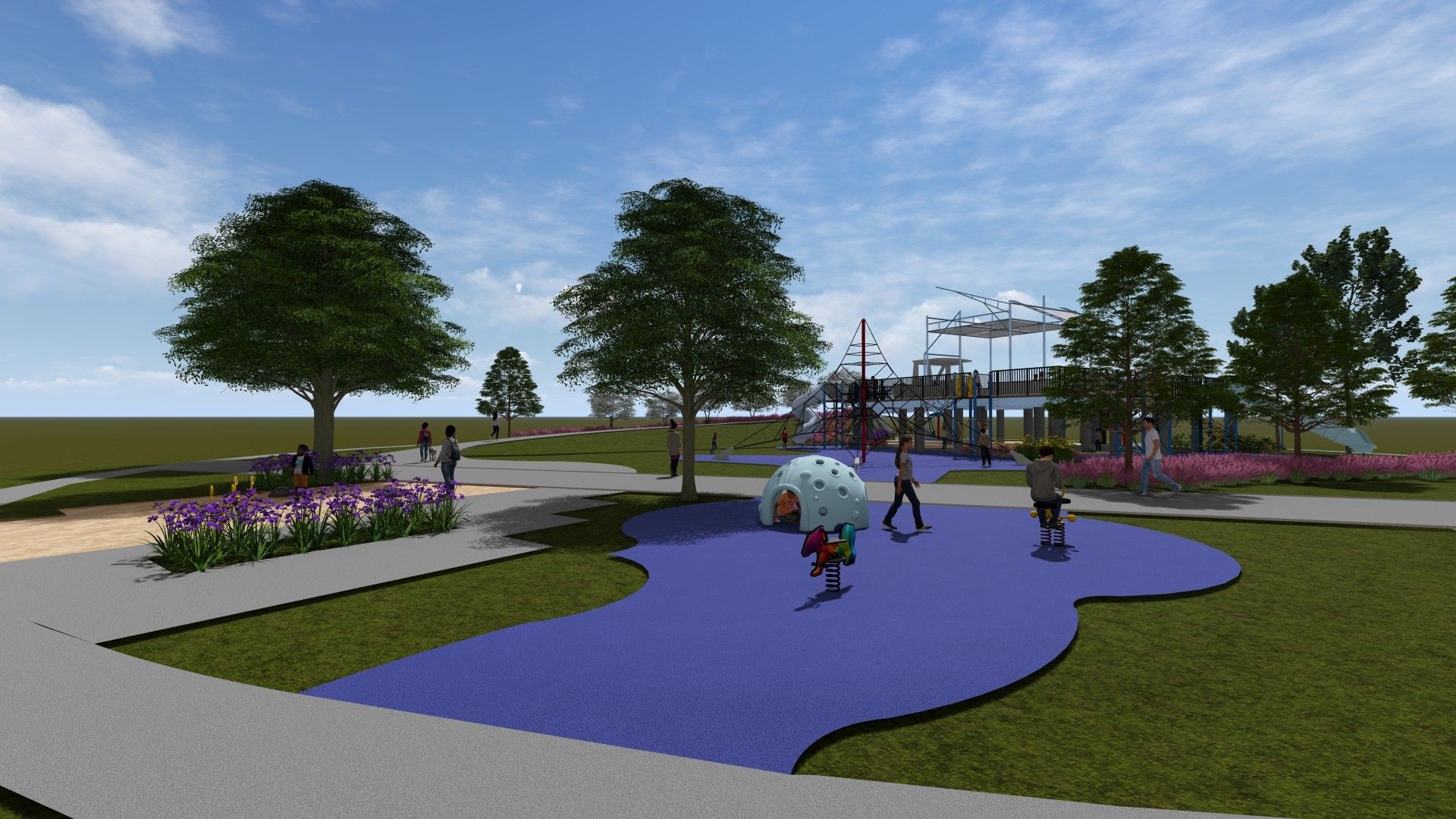 Outdoor playground with blue rubber flooring, trees, flower beds, walking paths, and people, including children playing on equipment, under a partly cloudy sky.