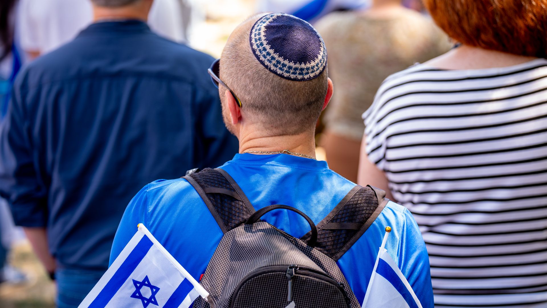 A Jewish man wears Israeli flags during a rally against campus antisemitism at George Washington University on May 2, 2024 in Washington, D.C. 