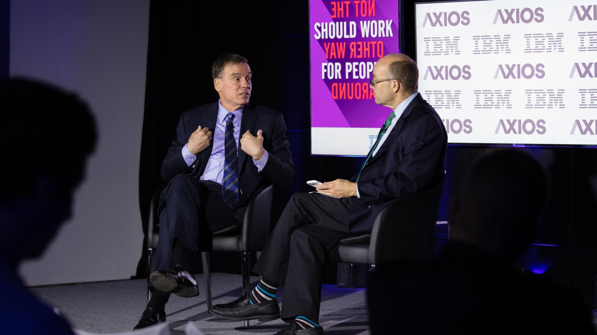 Sen. Warner speaking with Axios' Mike Allen on stage