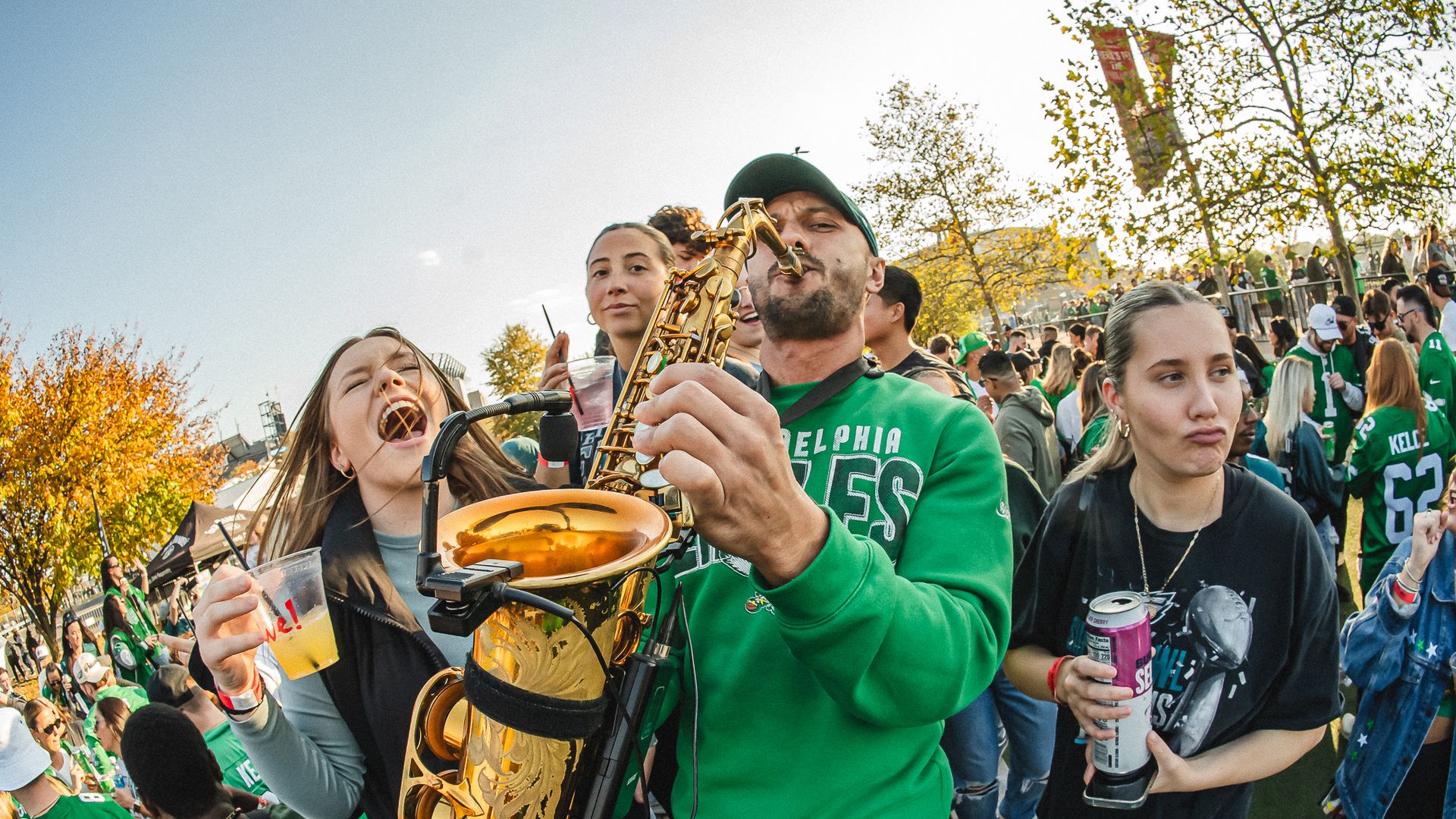 Vanya Sax, middle, performing at an Eagles tailgate event in 2023.