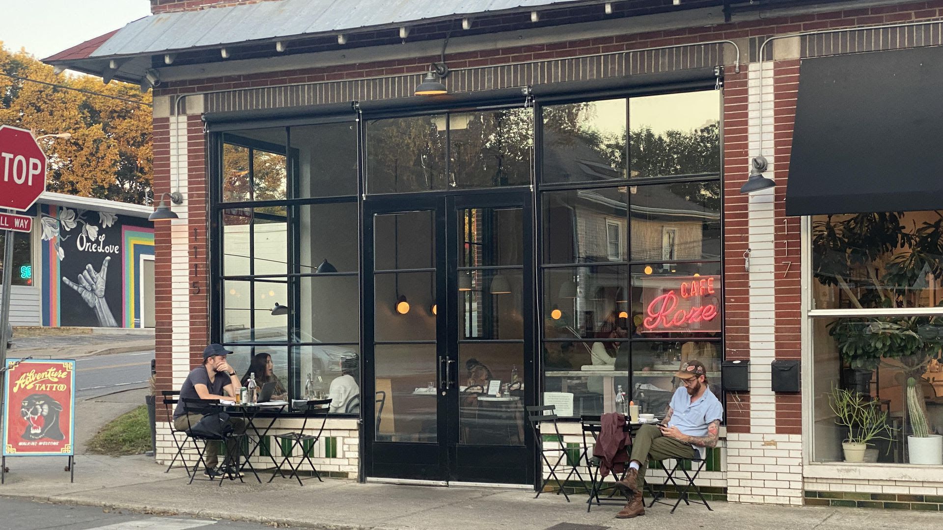 Two people sit outside of Cafe Roze, one of the Nashville restaurants that got a permit for sidewalk dining.