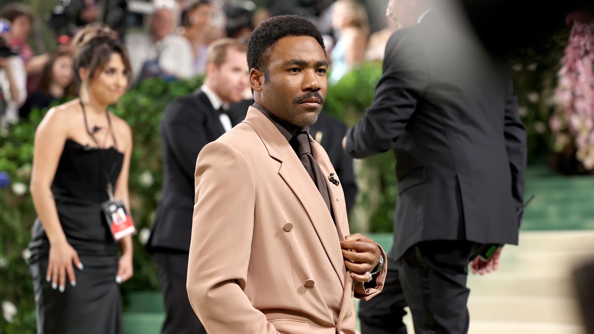 Childish Gambino poses for photos at the Meta Gala.