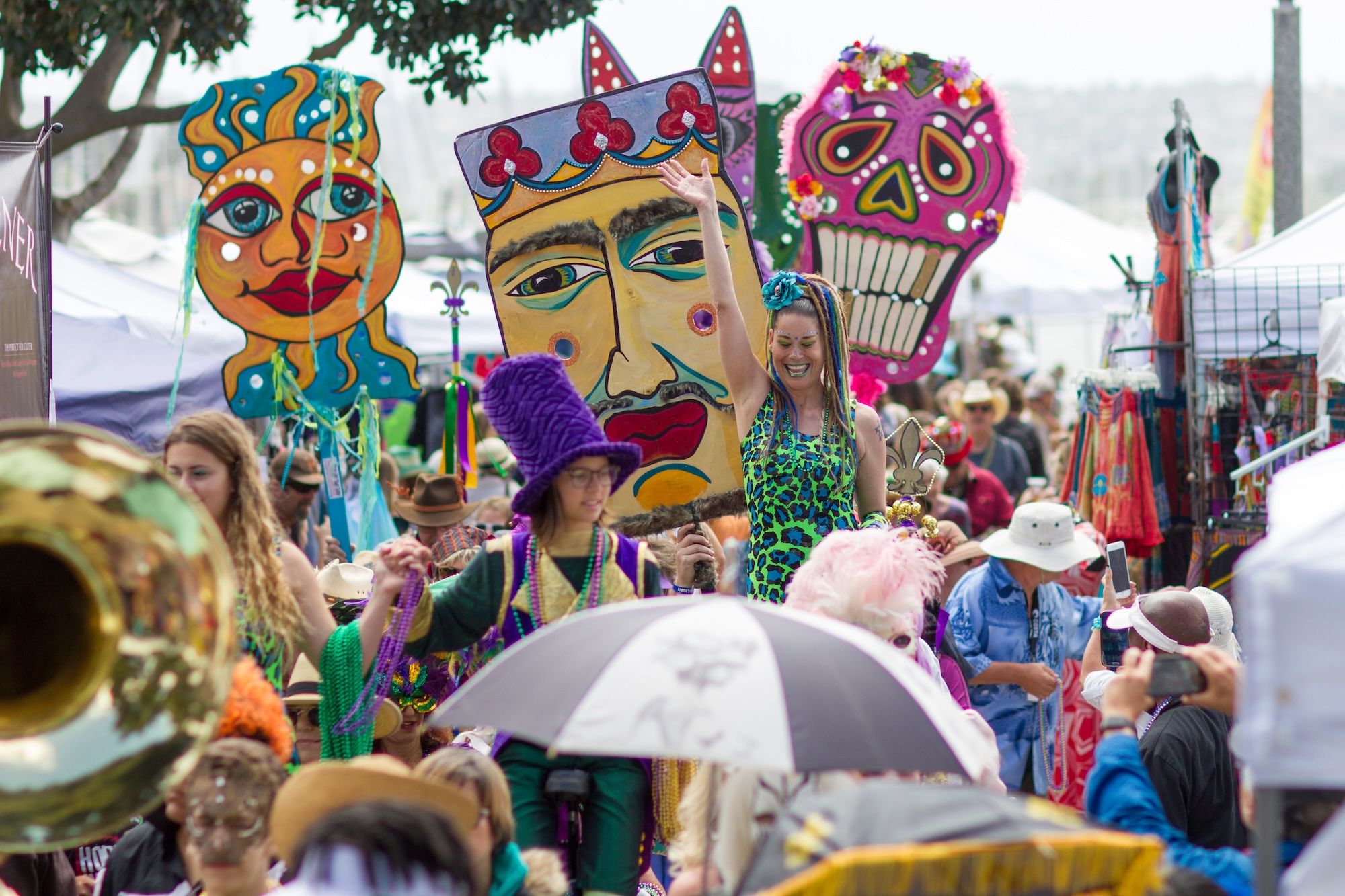 A group of people celebrate at a Louisiana-style festival. 