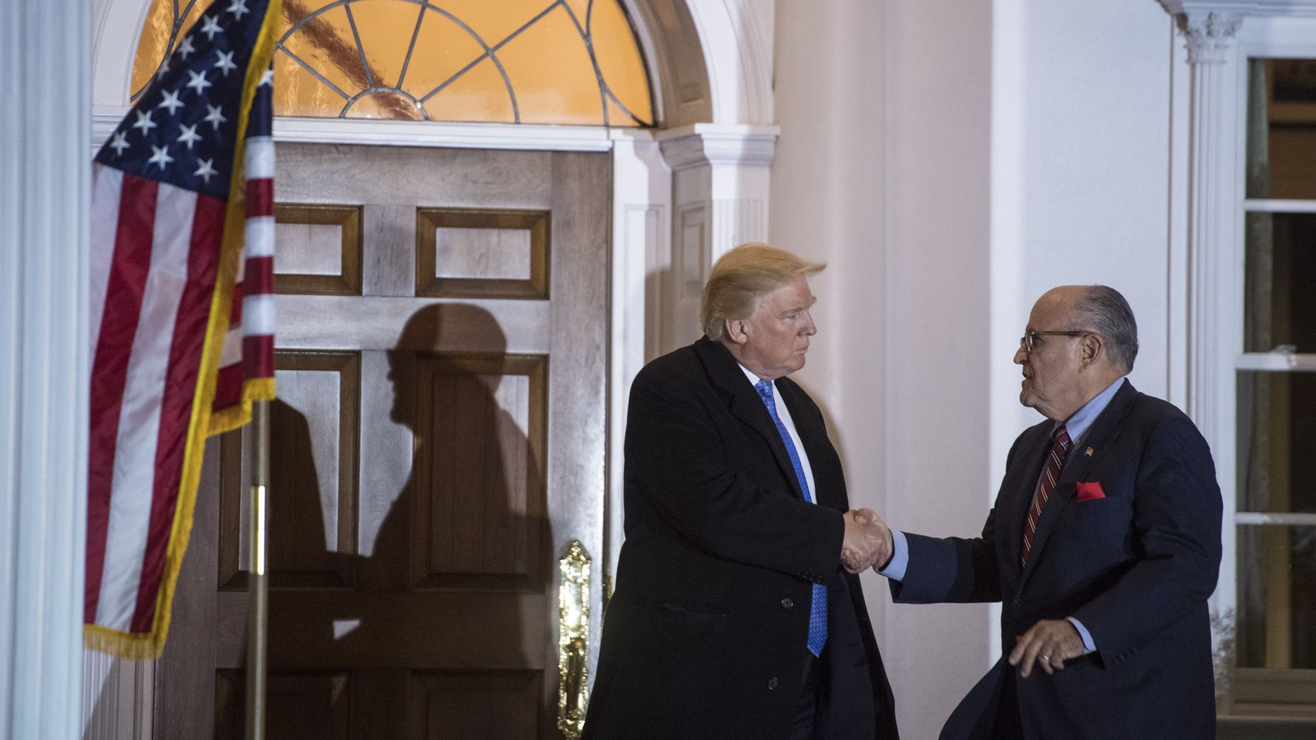 Picture of President Donald Trump and Rudy Giuliani shaking hands