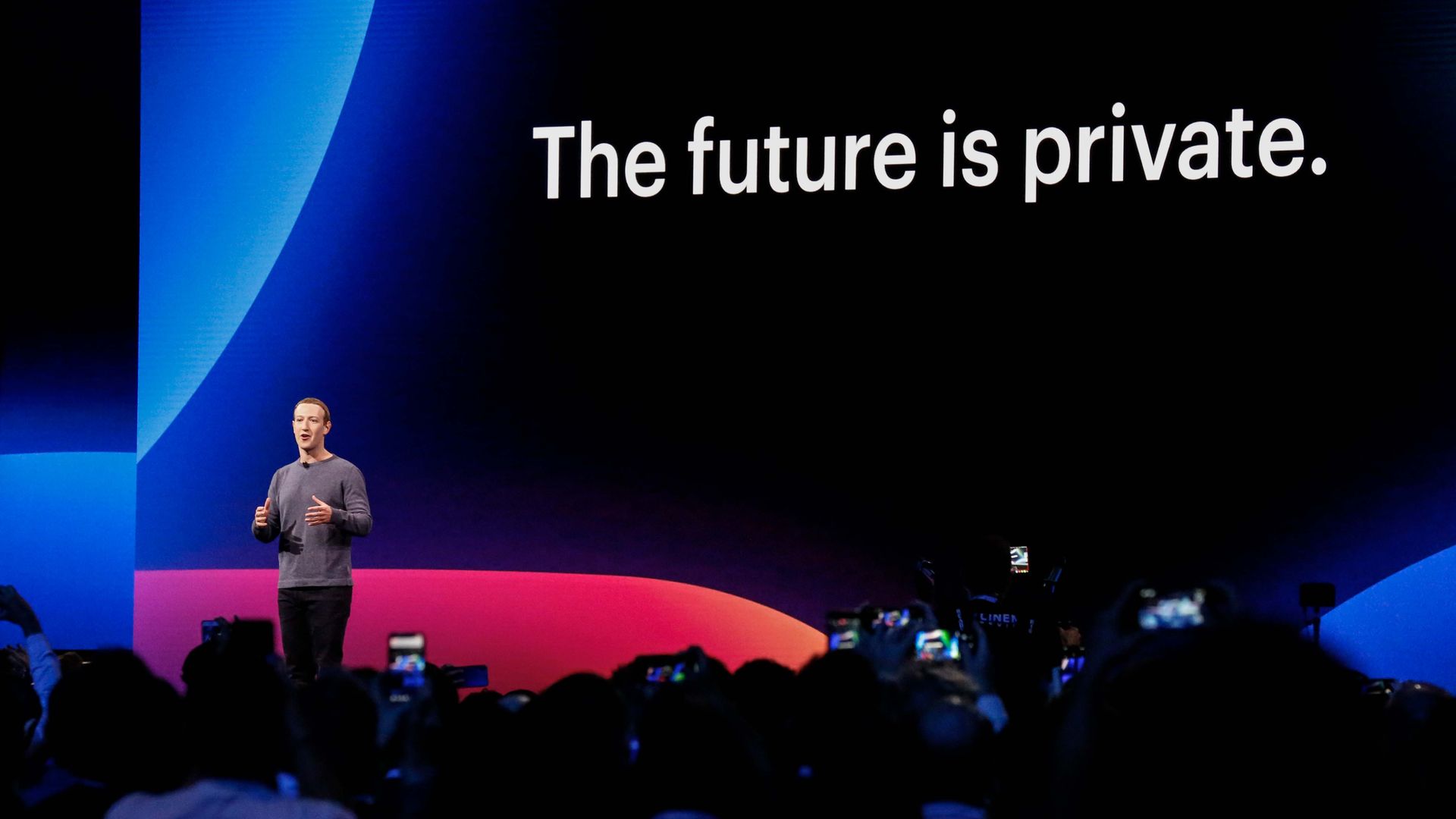 Photo of Mark Zuckerberg standing before crowd with slide reading "The future is private"