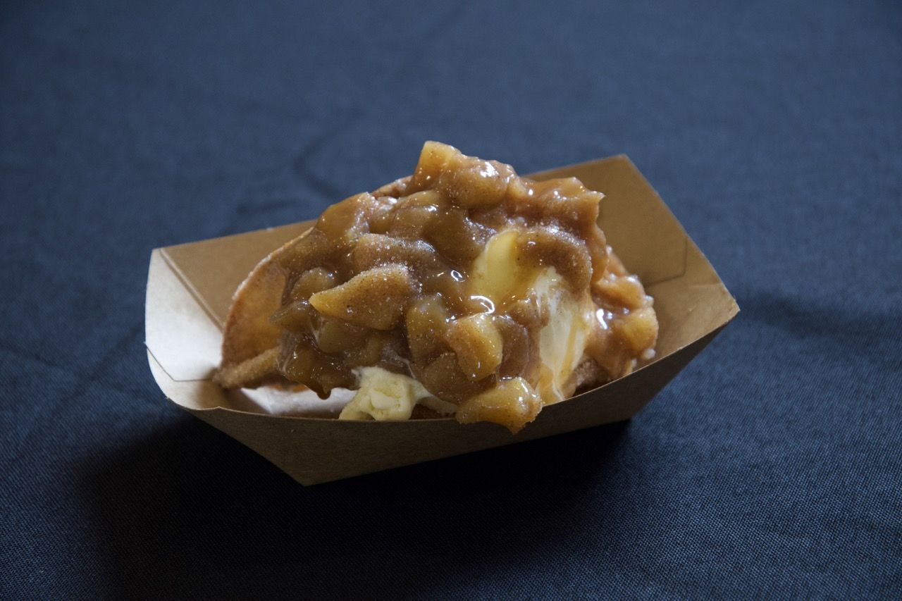 a cinnamon crunch apple taco in. a papeboat