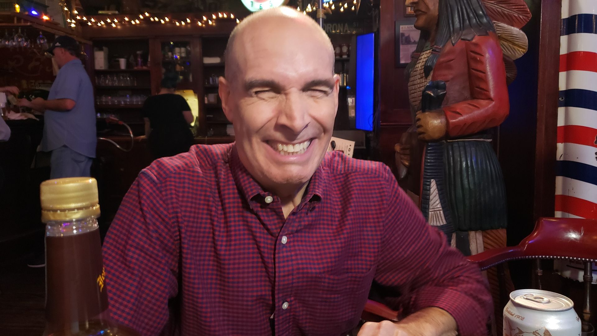 Photo of Geoffrey Baer in a bar.