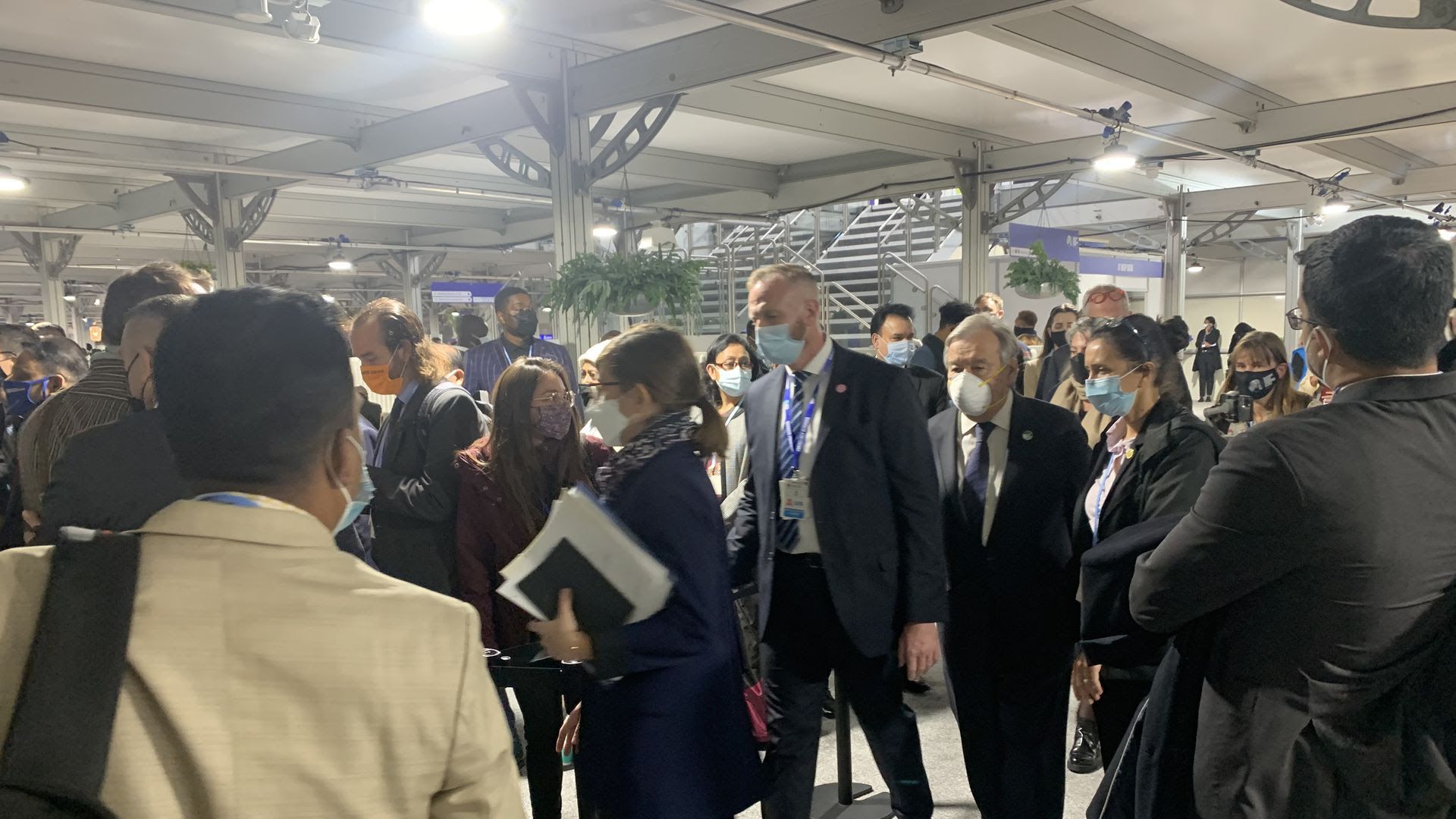 U.N. Secretary-General António Guterres walks the crowded halls of the COP26 climate summit in Scotland