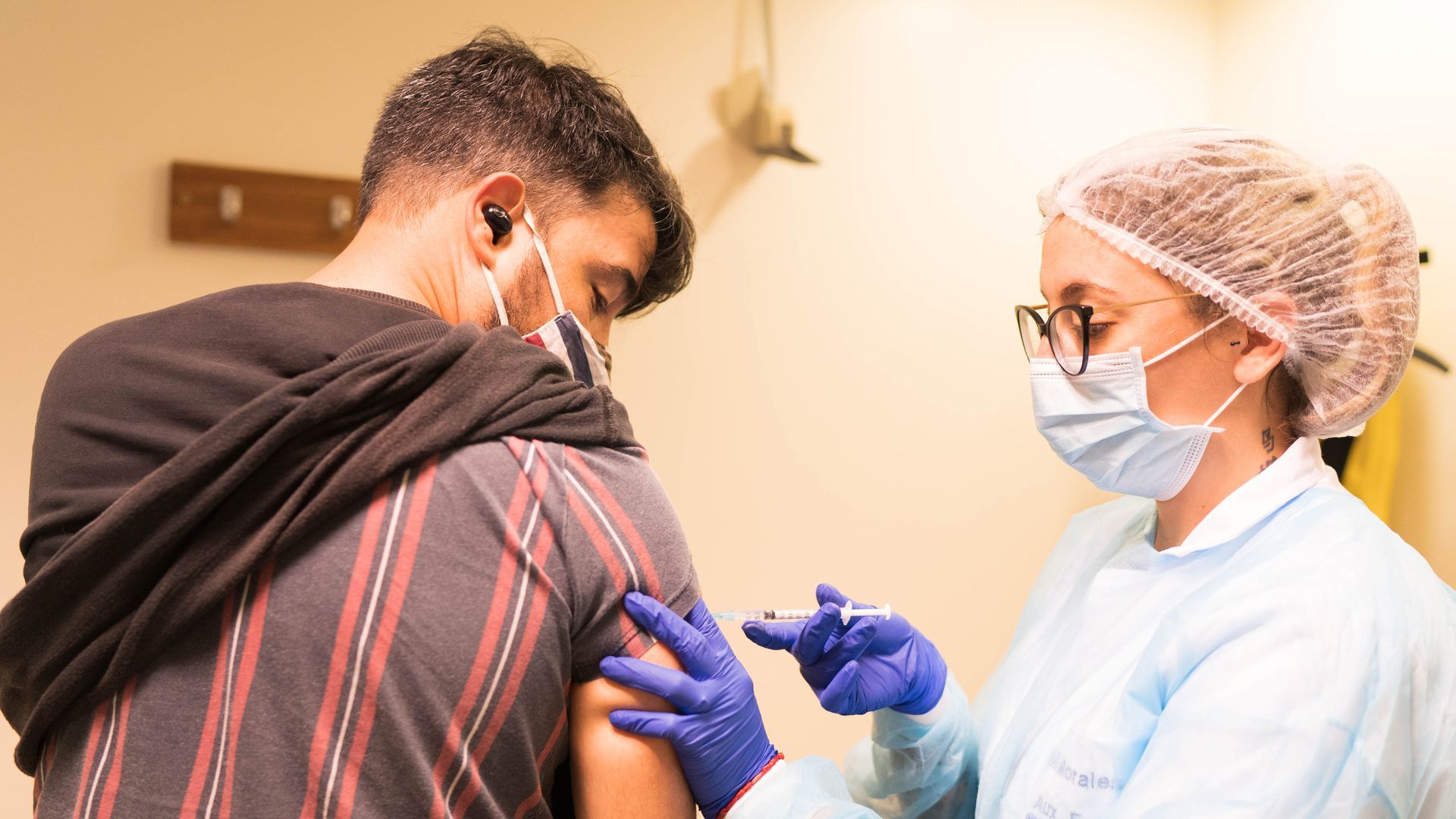 Picture of a man receiving a vaccine