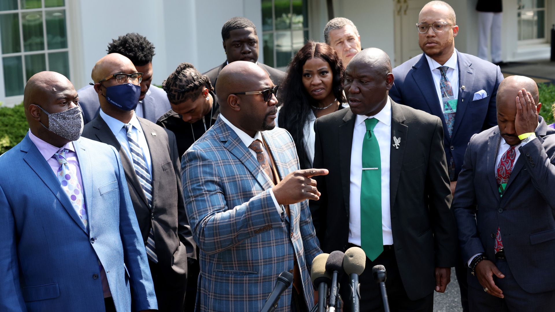 Philonise Floyd, brother of George Floyd, speaks with other members of the Floyd family as they answer questions outside the White House.
