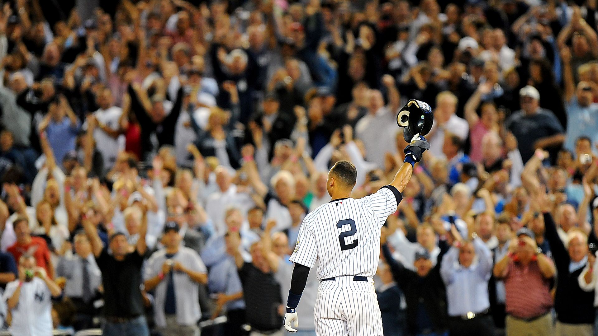 derek jeter tips his helmet to yankees fans