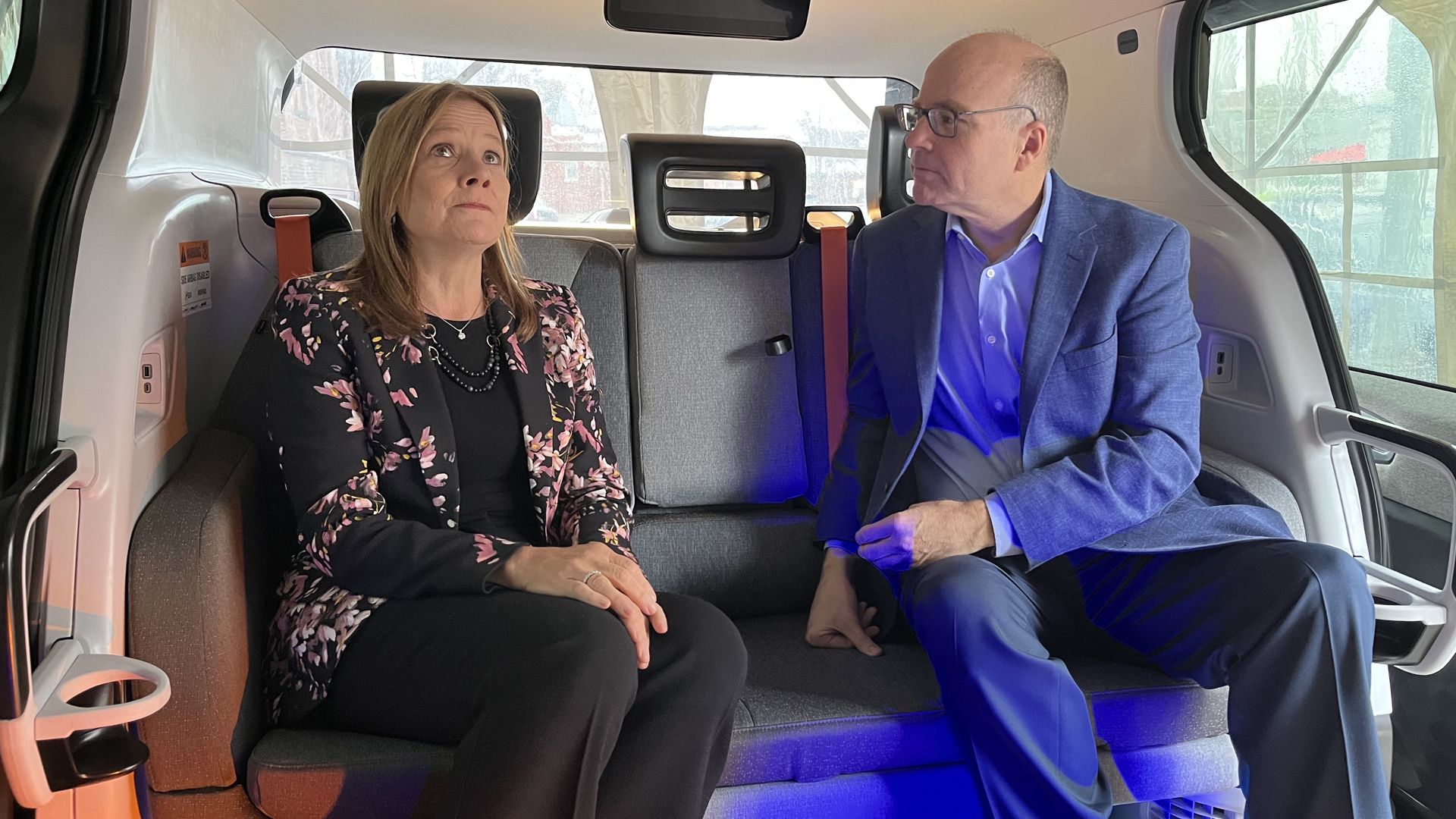 GM CEO Mary Barra and Axios co-founder Mike Allen inside the Cruise Origin robotaxi