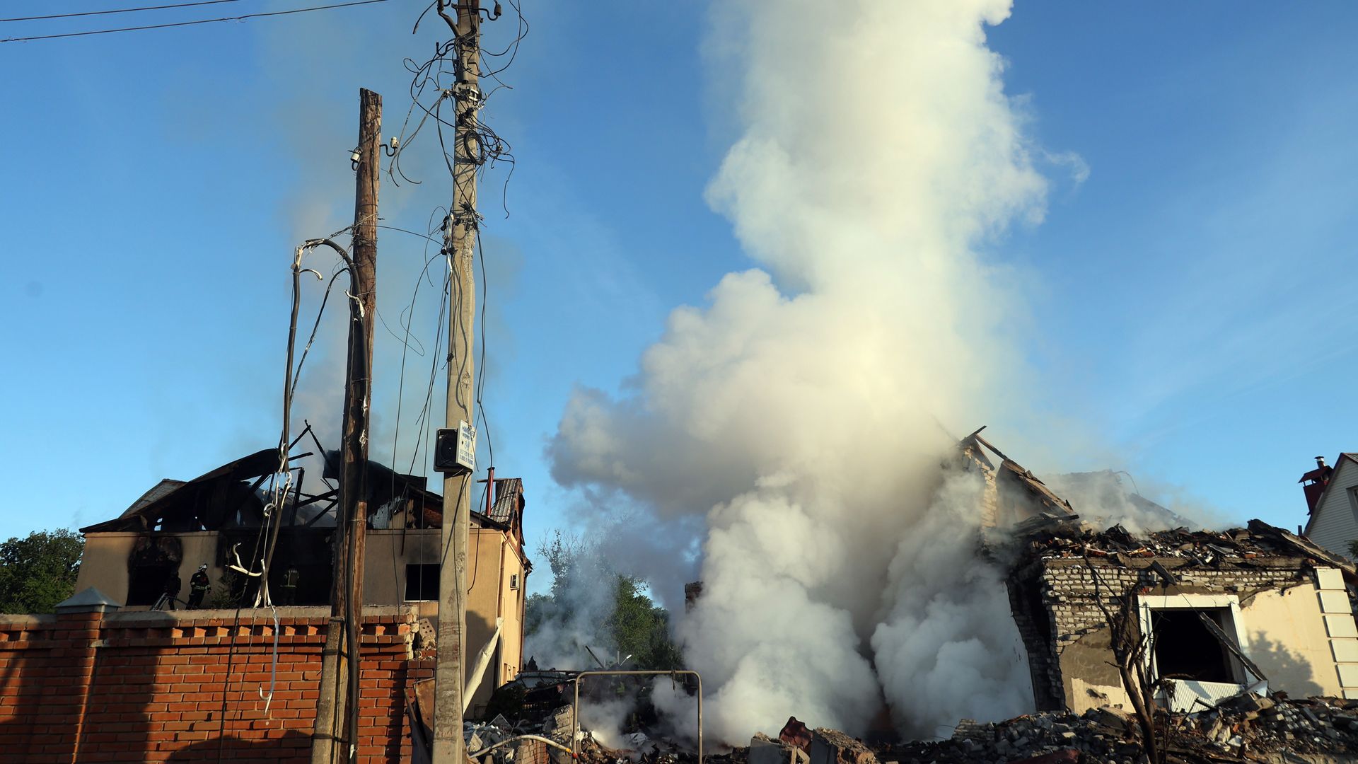 Smoke rises over a house after a Russian missile attack