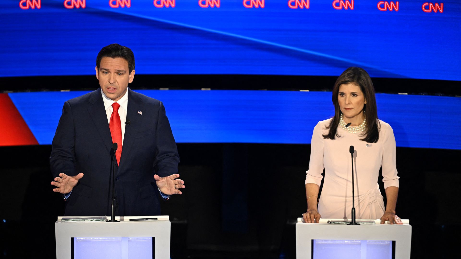 Florida Governor Ron DeSantis (L) and former US Ambassador to the UN Nikki Haley speak during the fifth Republican presidential primary debate at Drake University in Des Moines, Iowa, on January 10, 2024