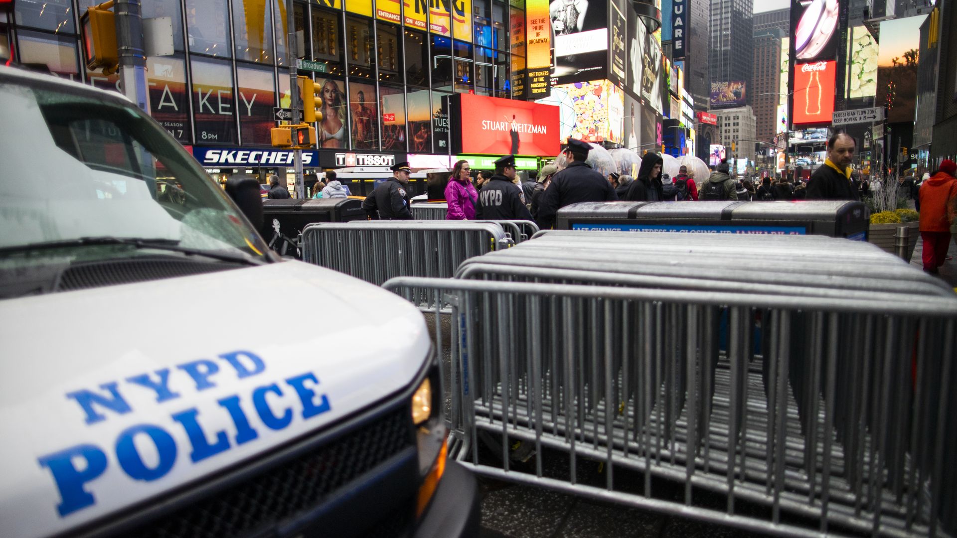 In this image, a NYPD vehicle says "NYPD police" on it