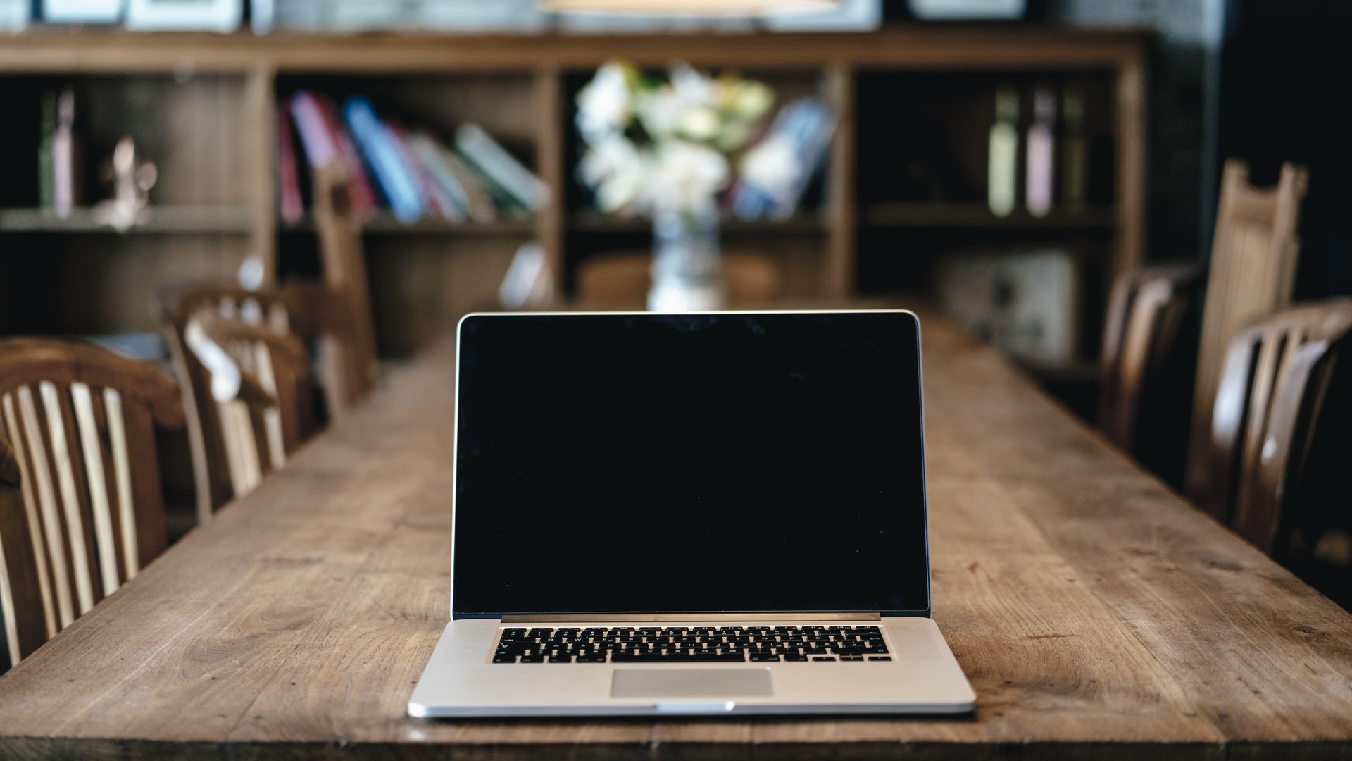 A laptop on an empty table