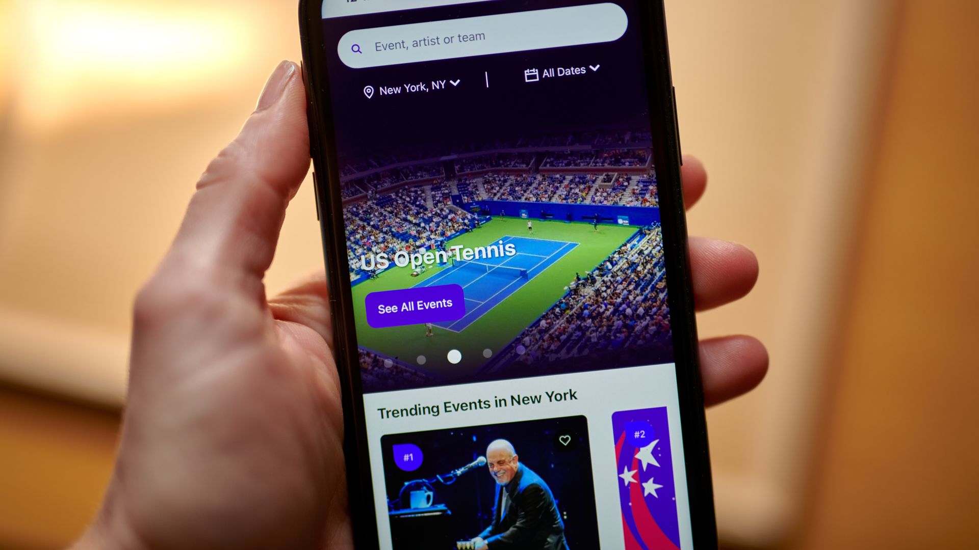 A smartphone displays the StubHub app featuring a page for the U.S. Open tennis tournament