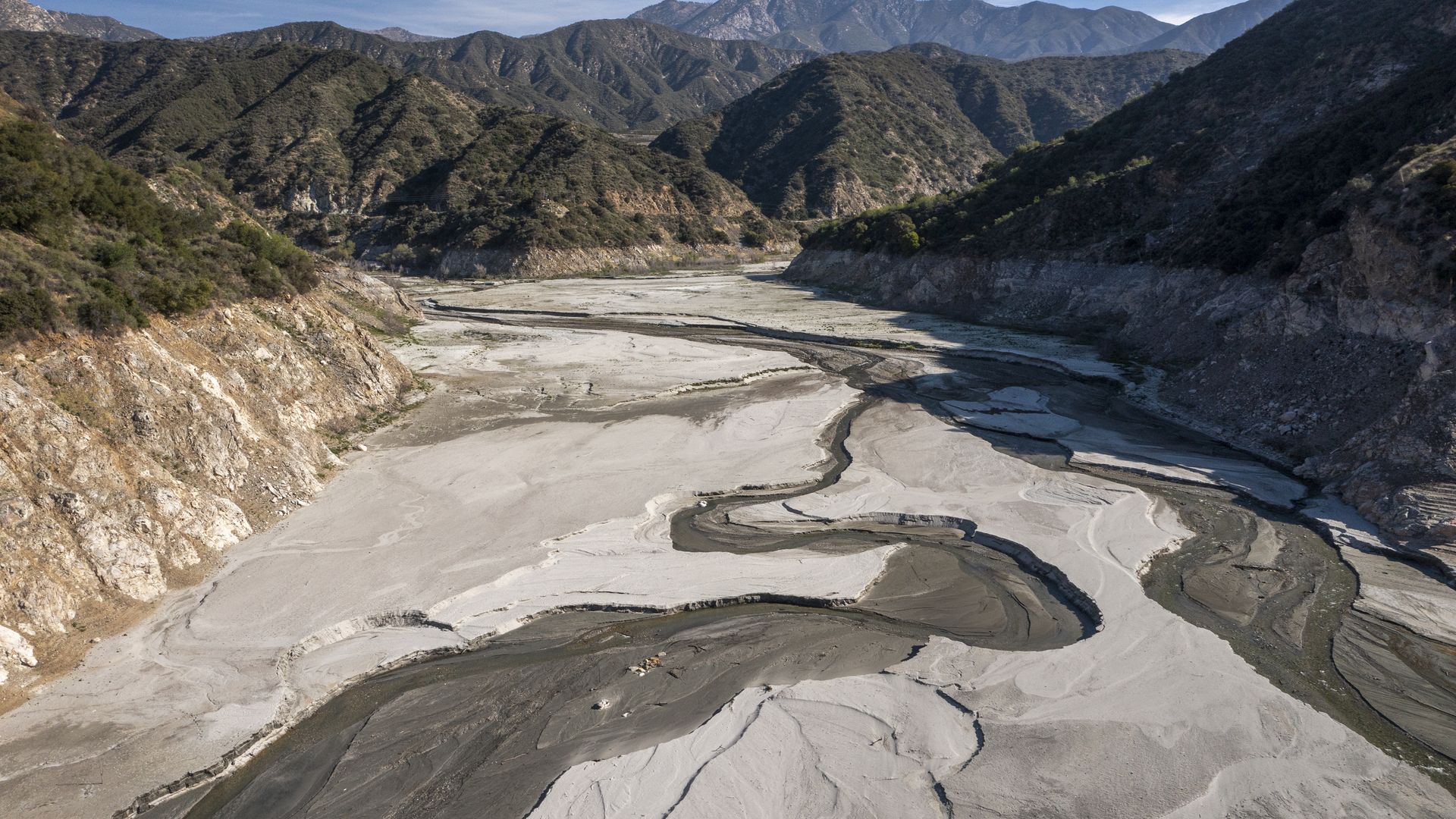 An exposed, dry lakebed in a California valley