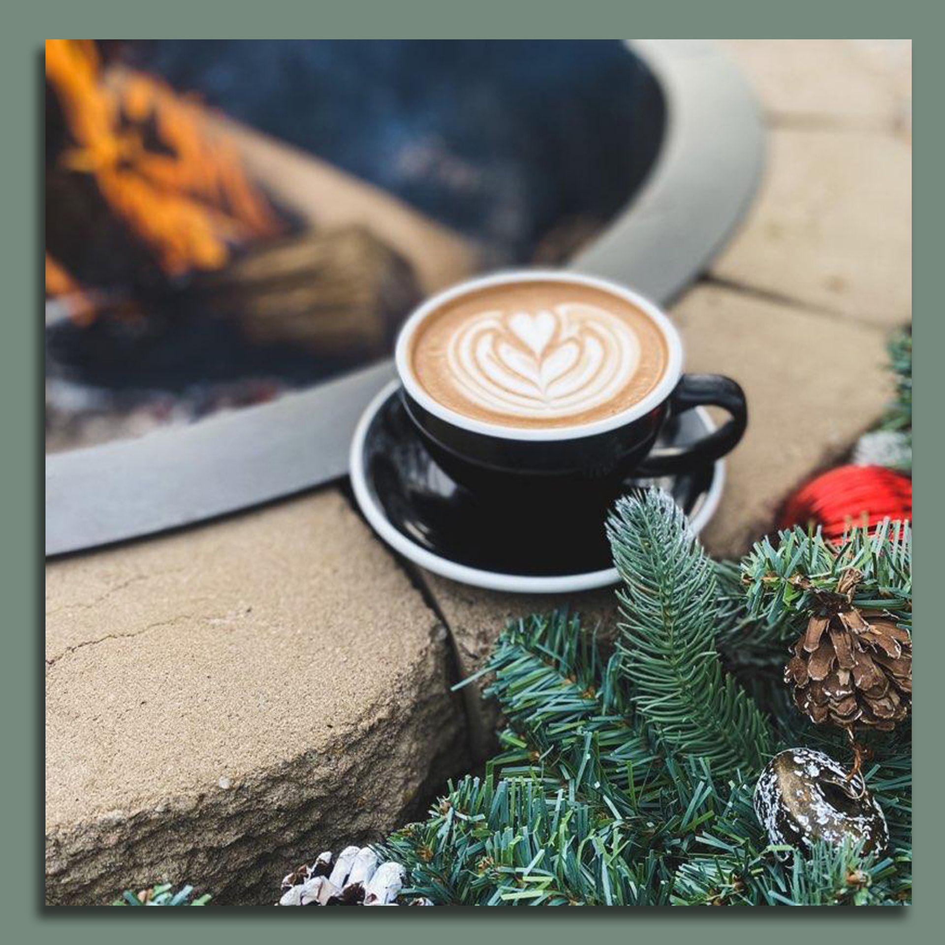 coffee latte art next to a fire