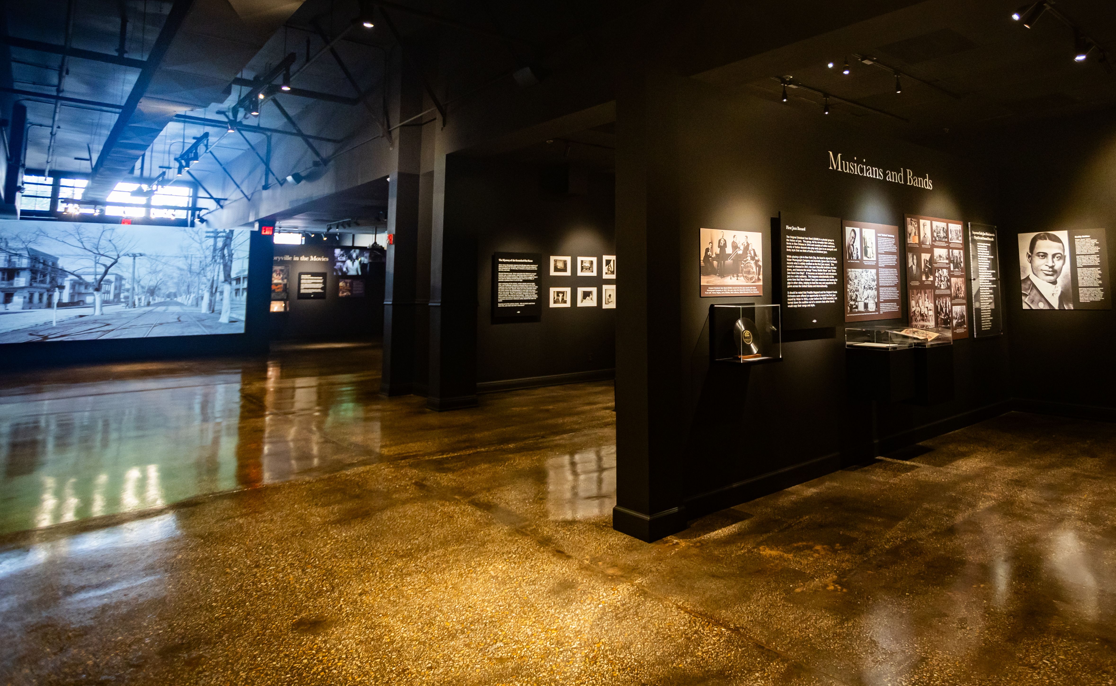 A wide view of multiple museum displays, including one on music.