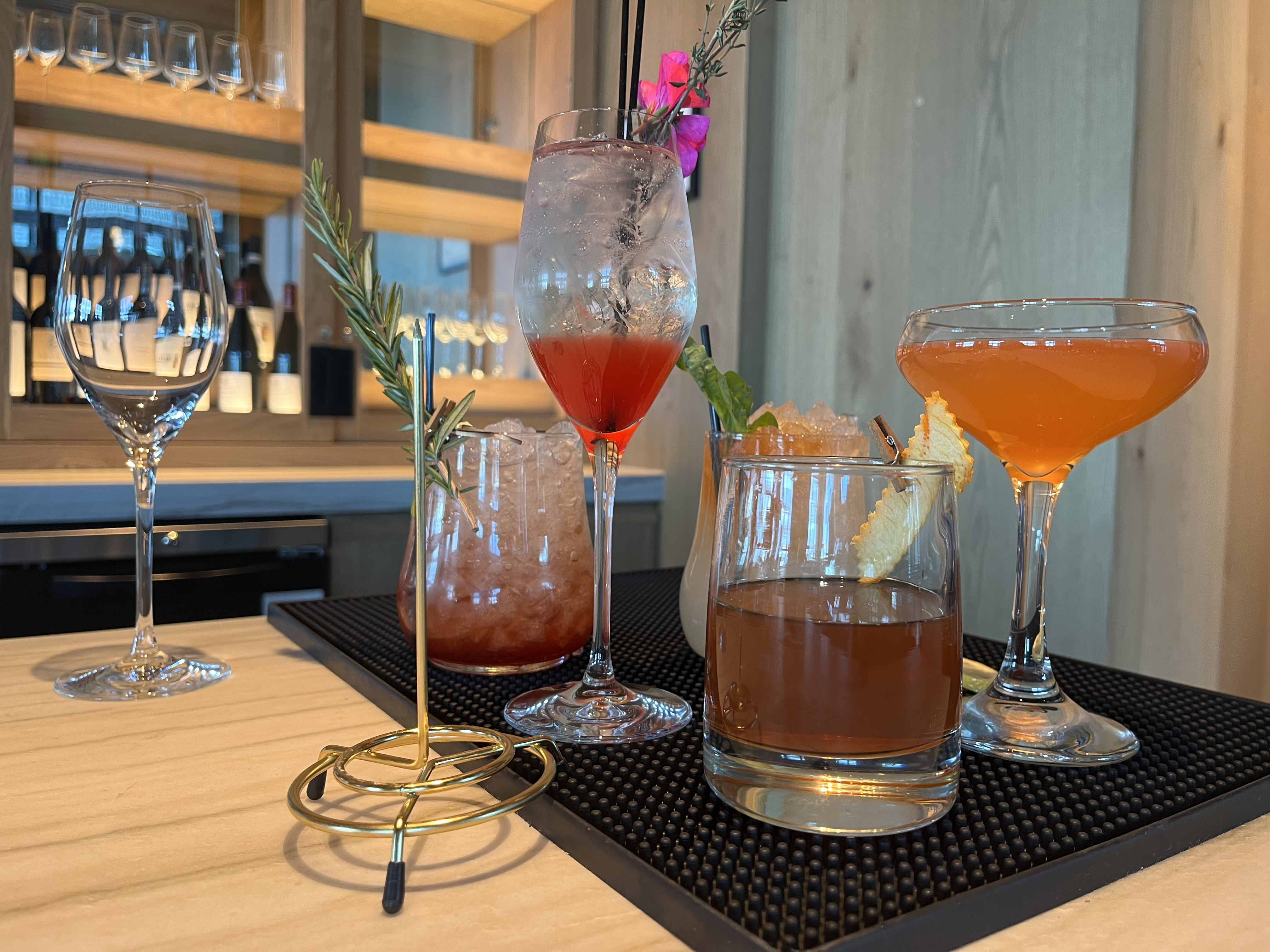 An array of five cocktails.