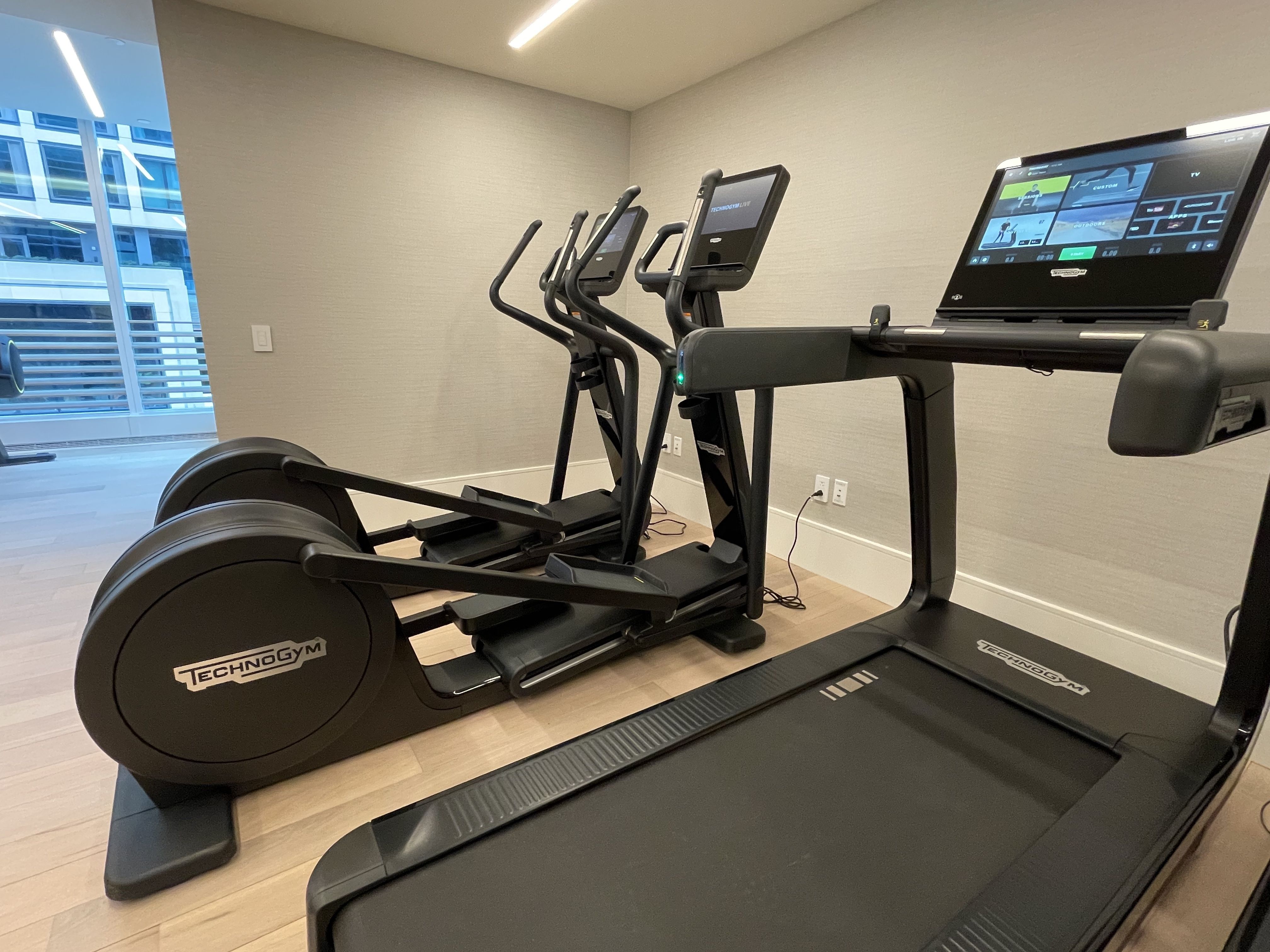 Technogym ellipticals and treadmills in the St. Regis fitness room on the fourth floor.