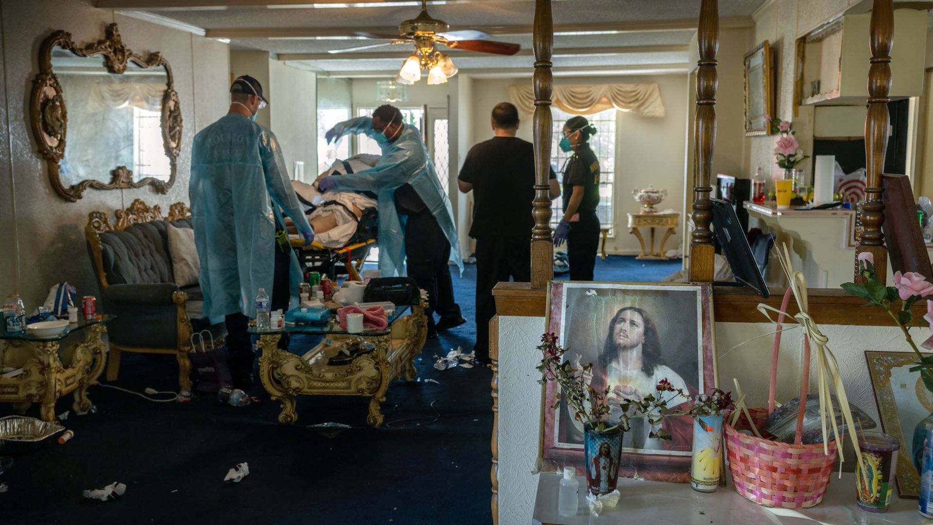 EMS paramedics prepare to transport a COVID-positive woman to a hospital on August 25, 2021 in Houston, Texas.