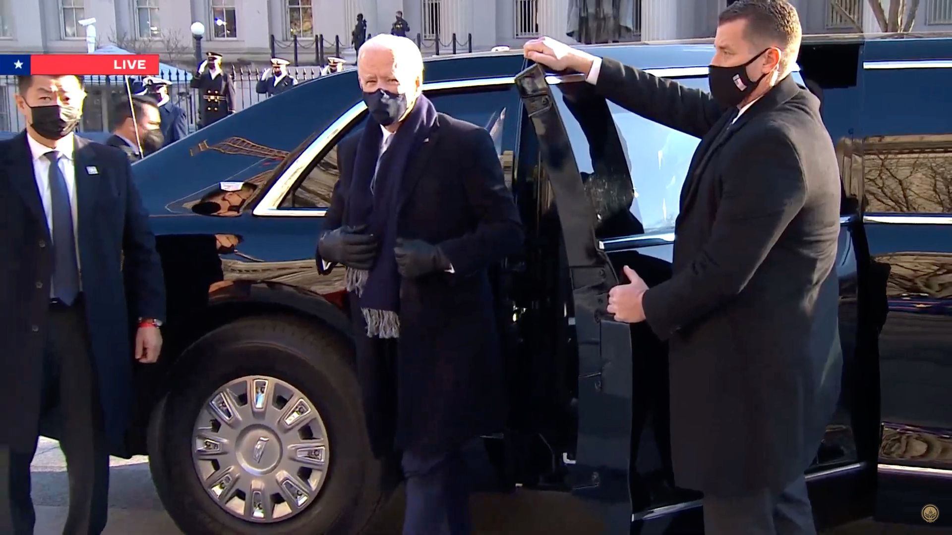 Biden steps out of "The Beast" to join a brief inaugural parade.