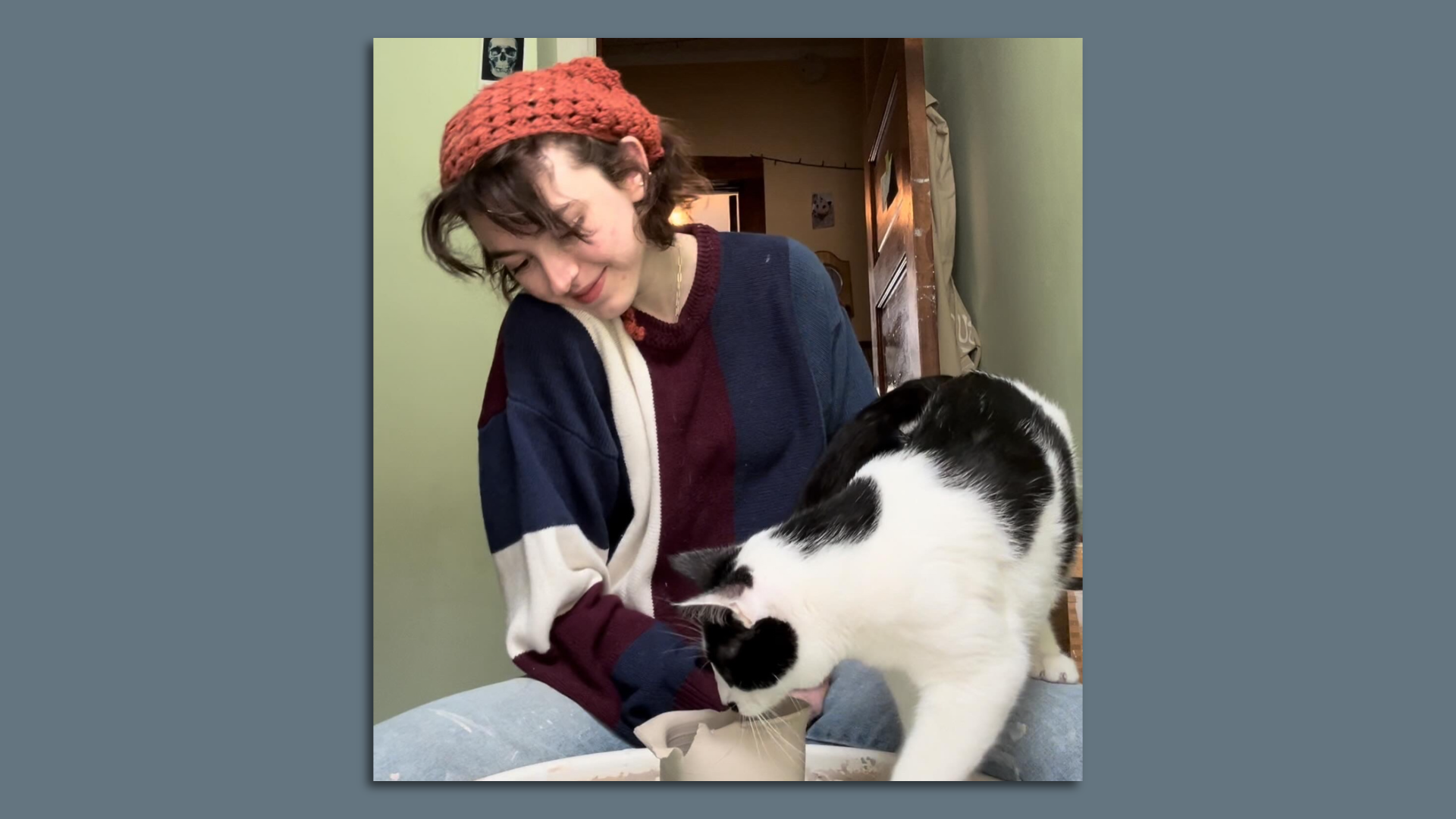 Female potter with cat