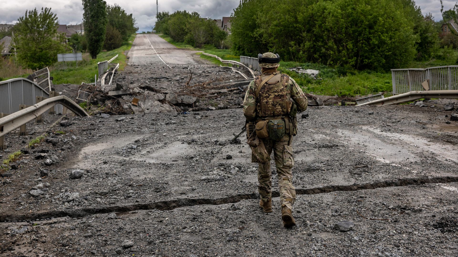 Ukrainian Territorial Defense soldiers patrol near the frontline on May 22, 2022 near Ruska Lozova, Ukraine. 
