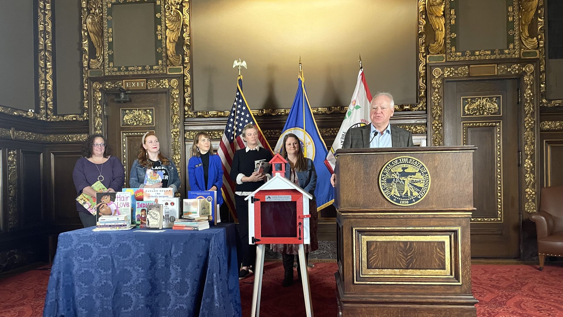 Gov. Tim Walz at a news confrence for little free libraries