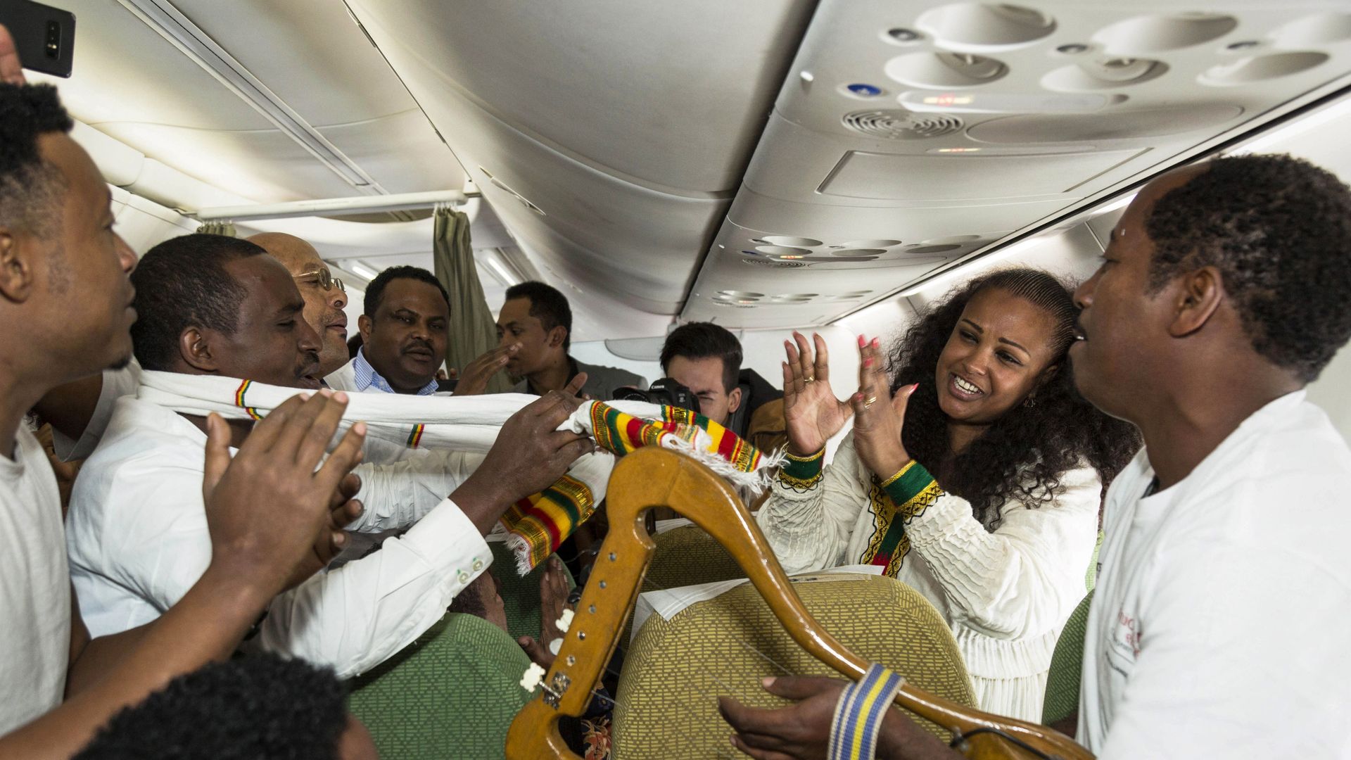 Passengers sing and dance during the first flight between the Ethiopian capital Addis Ababa and the Eritrean capital Asmara in twenty years. Photo: Michael Tewelde/AFP/Getty Images
