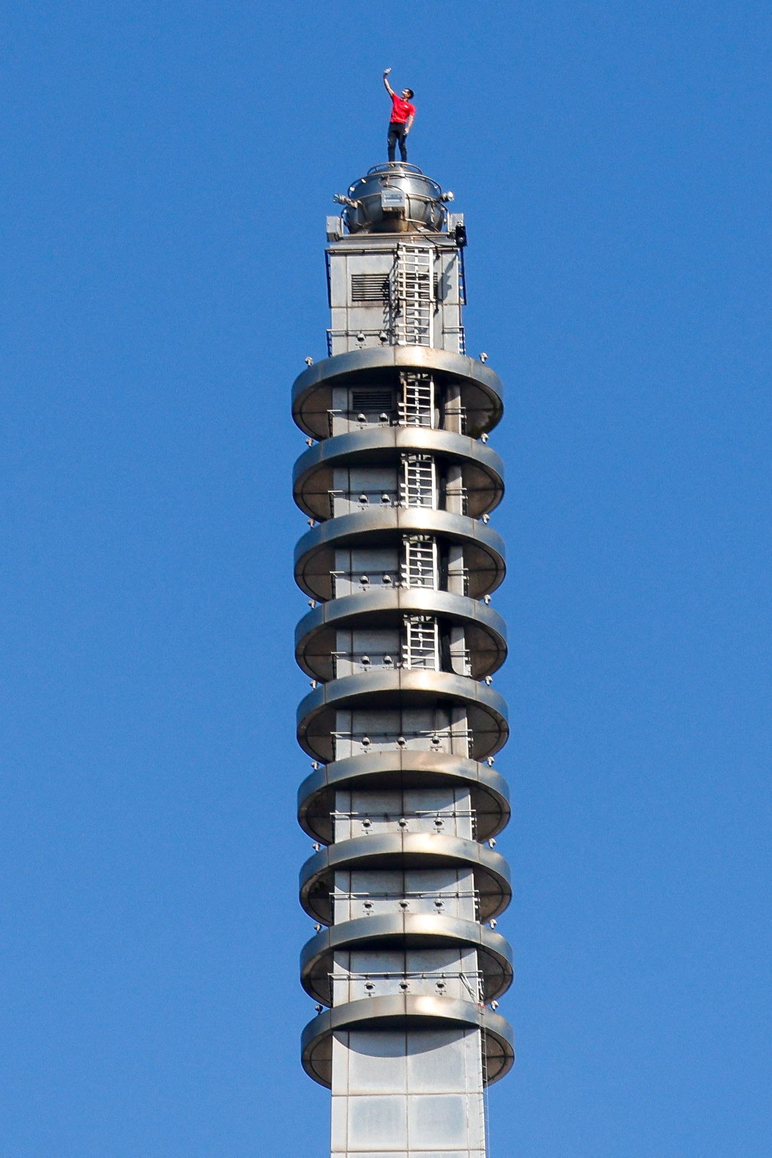 Climber Alex Honnold takes a selfie atop Taipei 101 after free soloing the skyscraper in Taiwan.