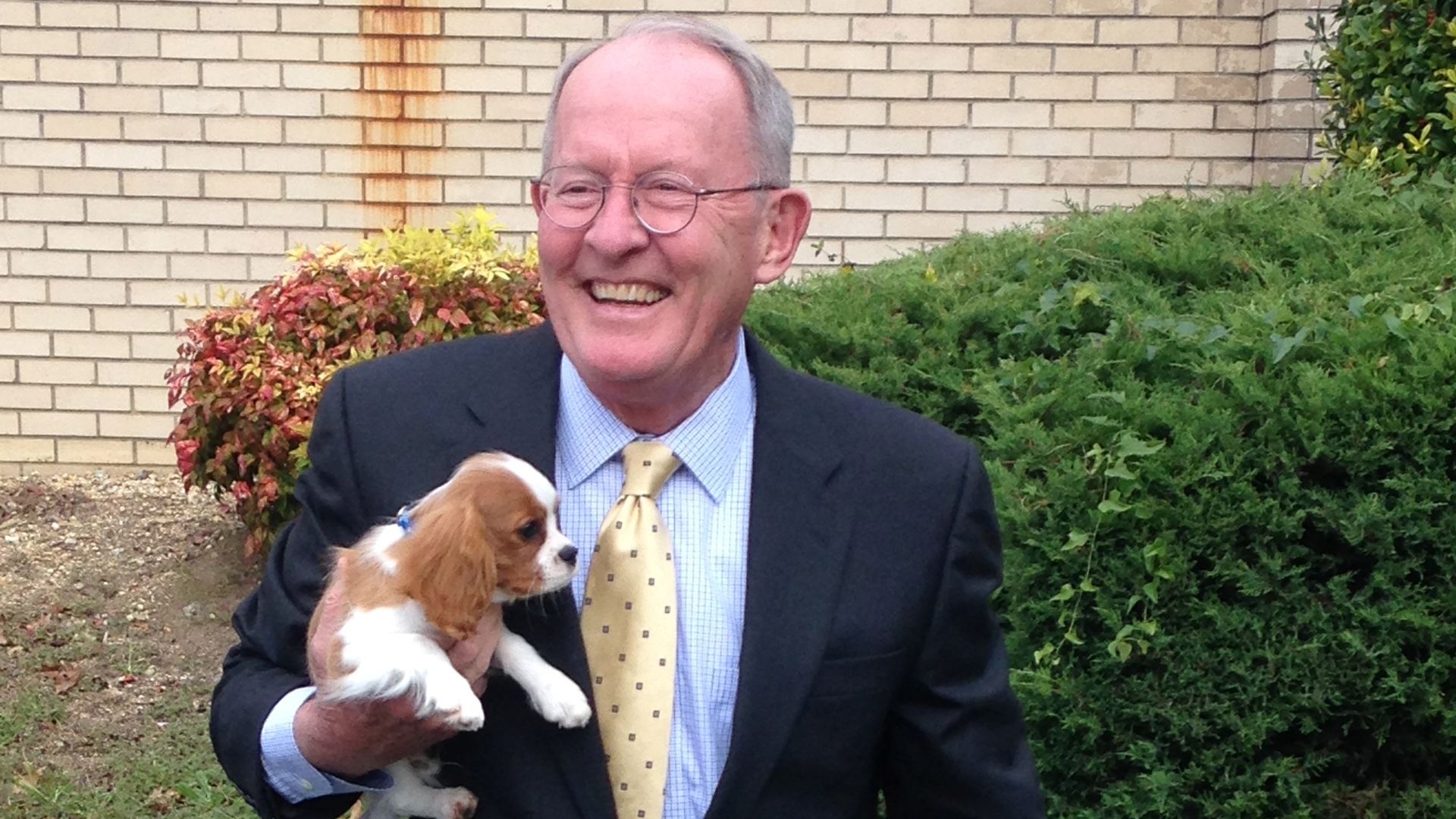Sen. Lamar Alexander holds his dog, Rufus