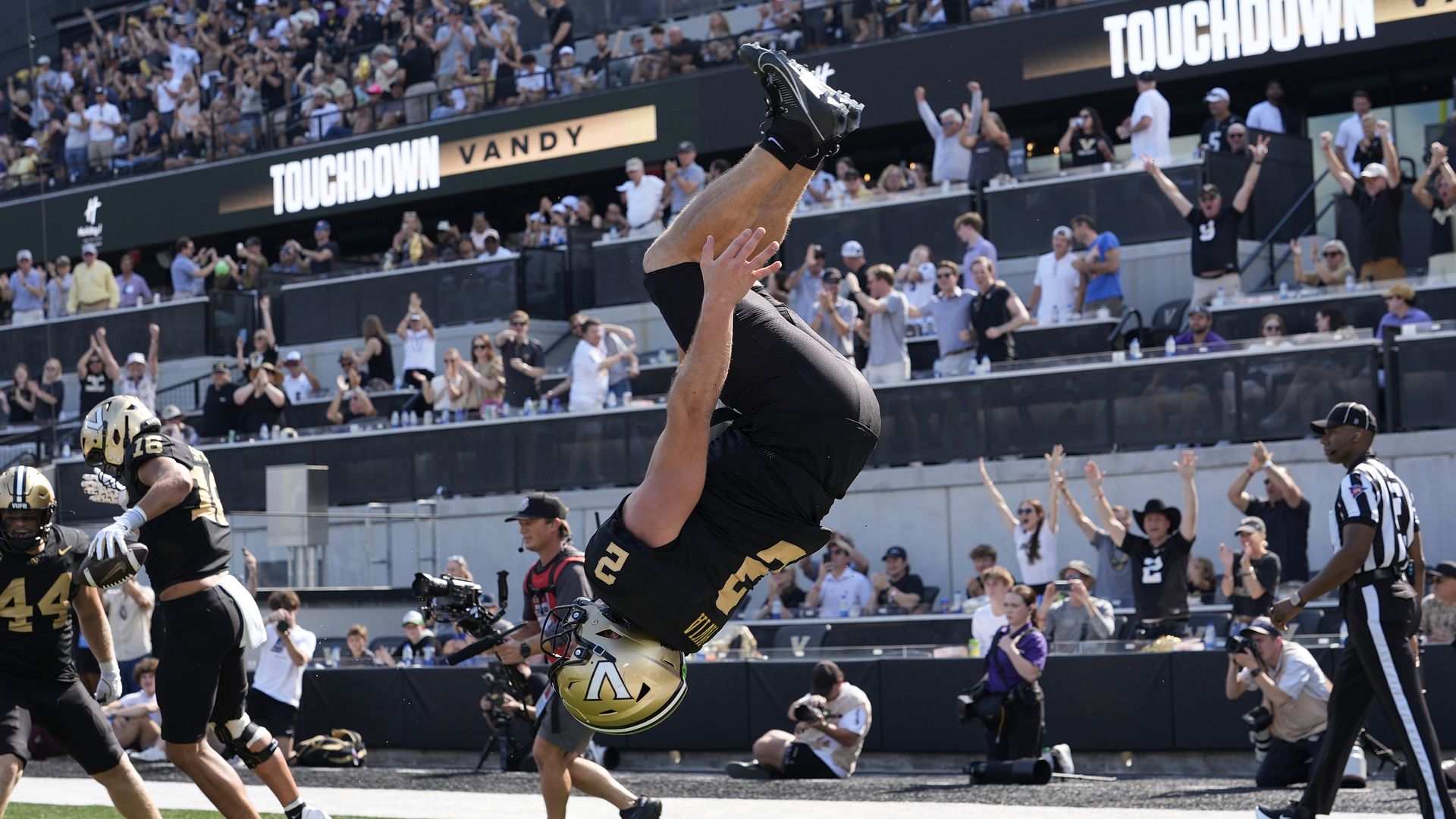 Diego Pavia #2 does a backflip to celebrate a touchdown pass in the third quarter during a college football game against the LSU Tigers on October 18, 2025 at FirstBank Stadium in Nashville, Tennessee. 